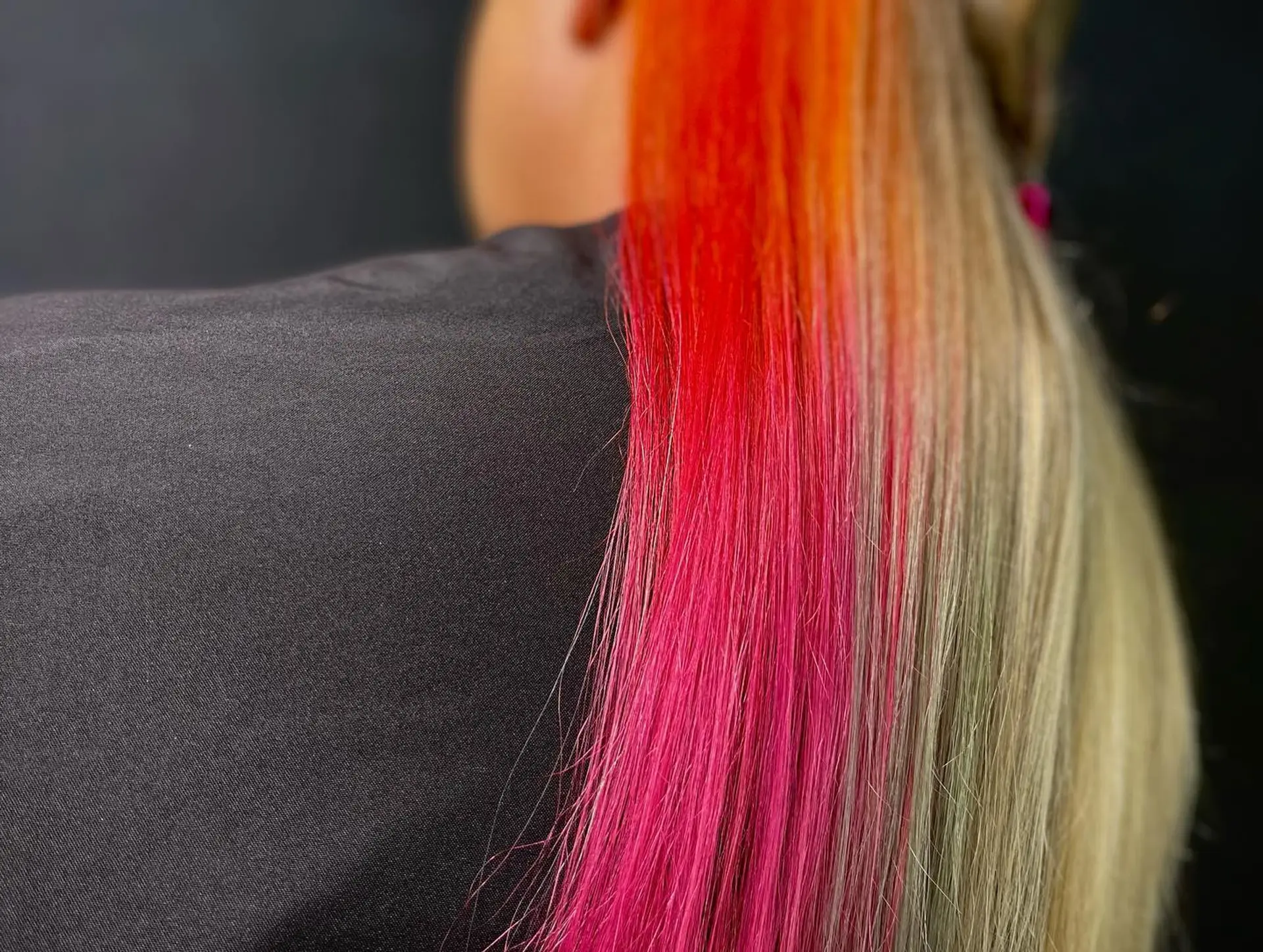 Long straight blonde hair with hidden vibrant color panels underneath. 4