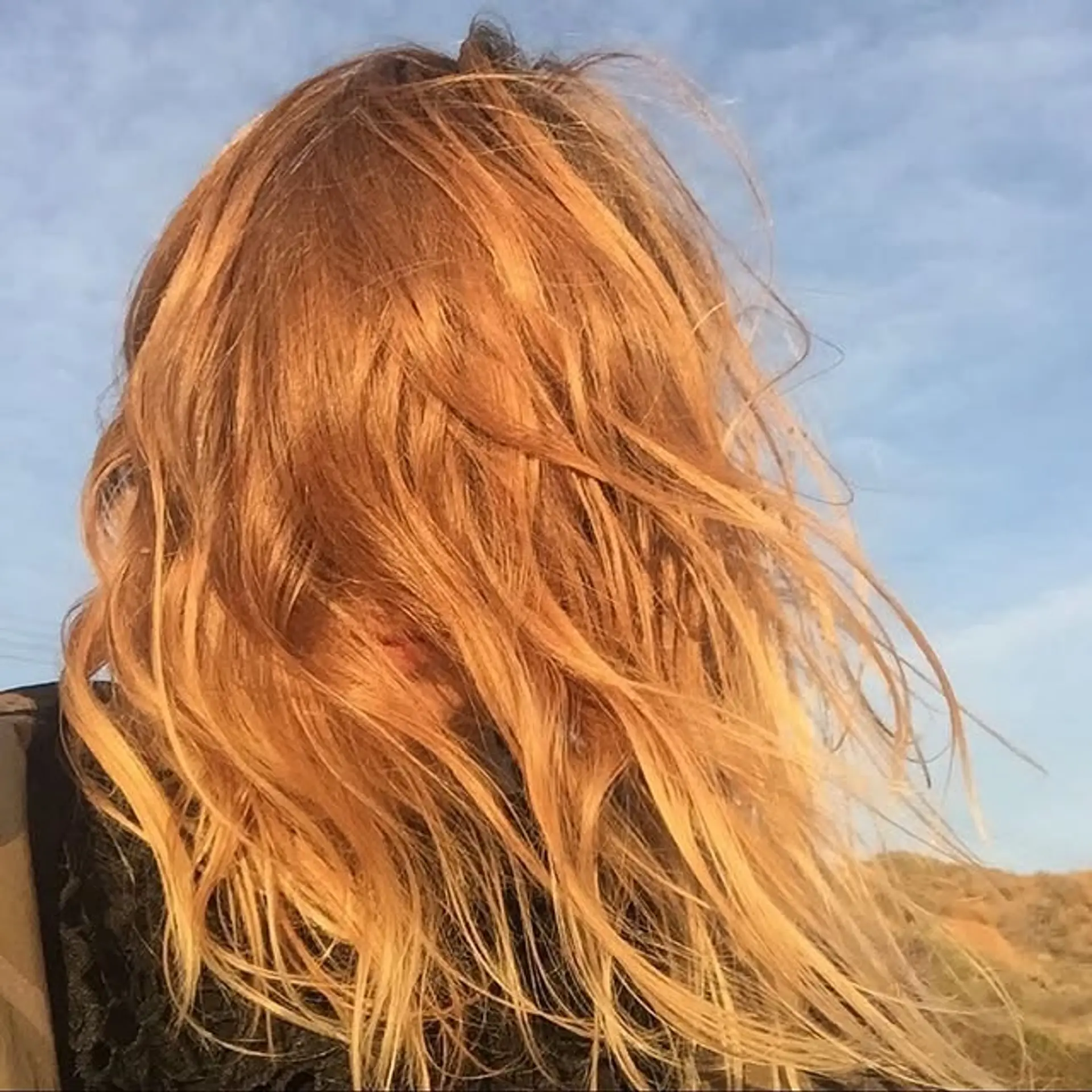 Medium length wavy hair with a golden ombre effect. 1