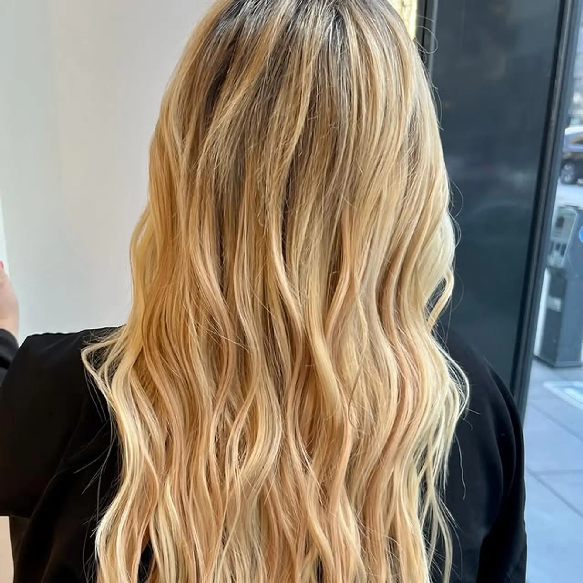 Long, wavy hair with a blonde balayage. 1