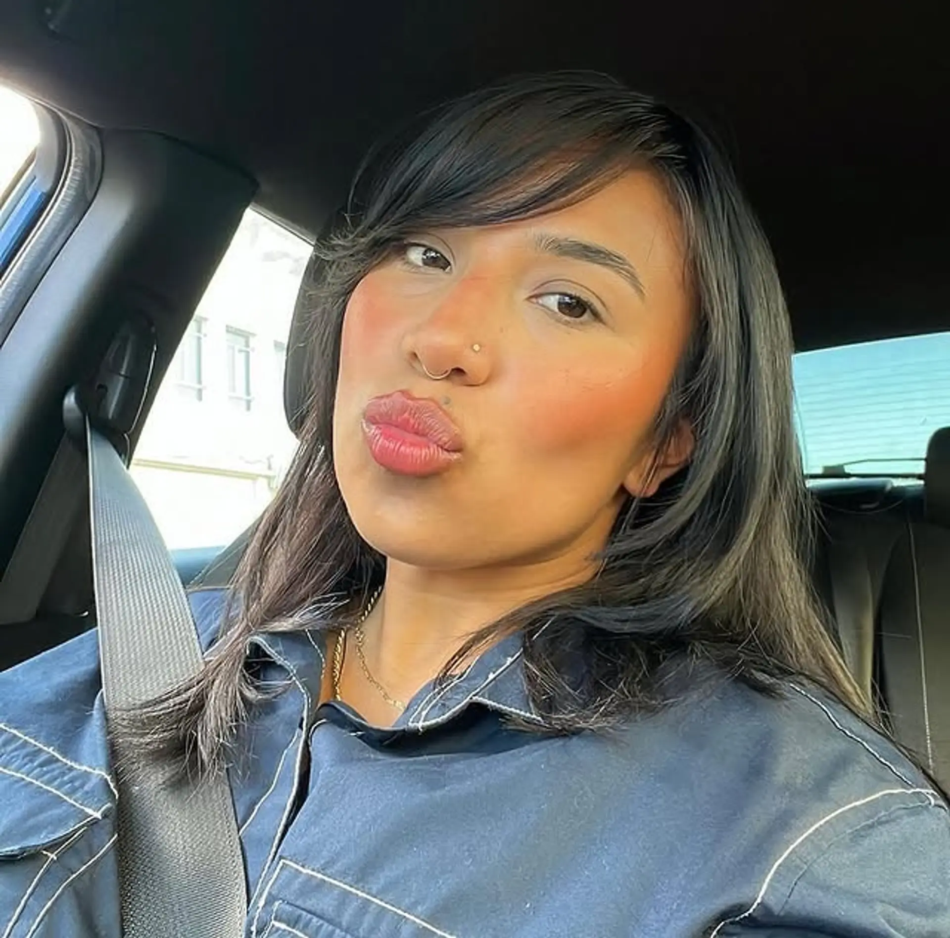 This hairstyle features face-framing layers and curtain bangs. 1