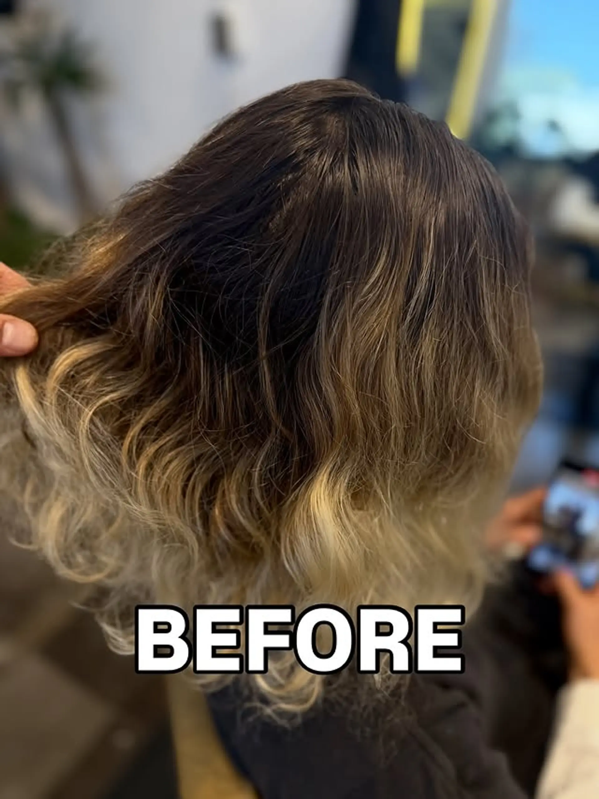Wavy hairstyle with a blended balayage ombre color technique. 1