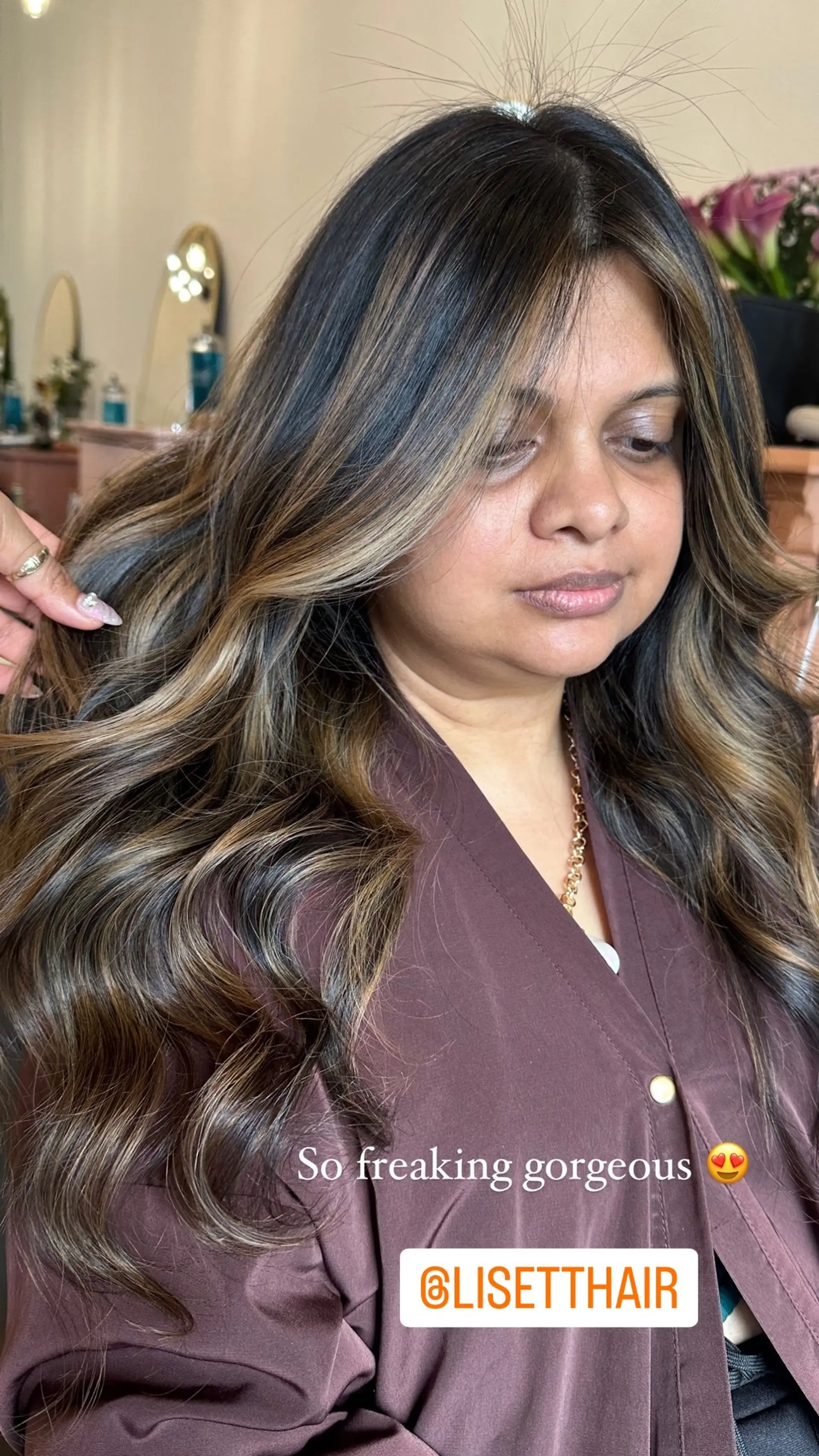 Long, wavy hair with a bronzed balayage effect, featuring caramel and blonde highlights. 1