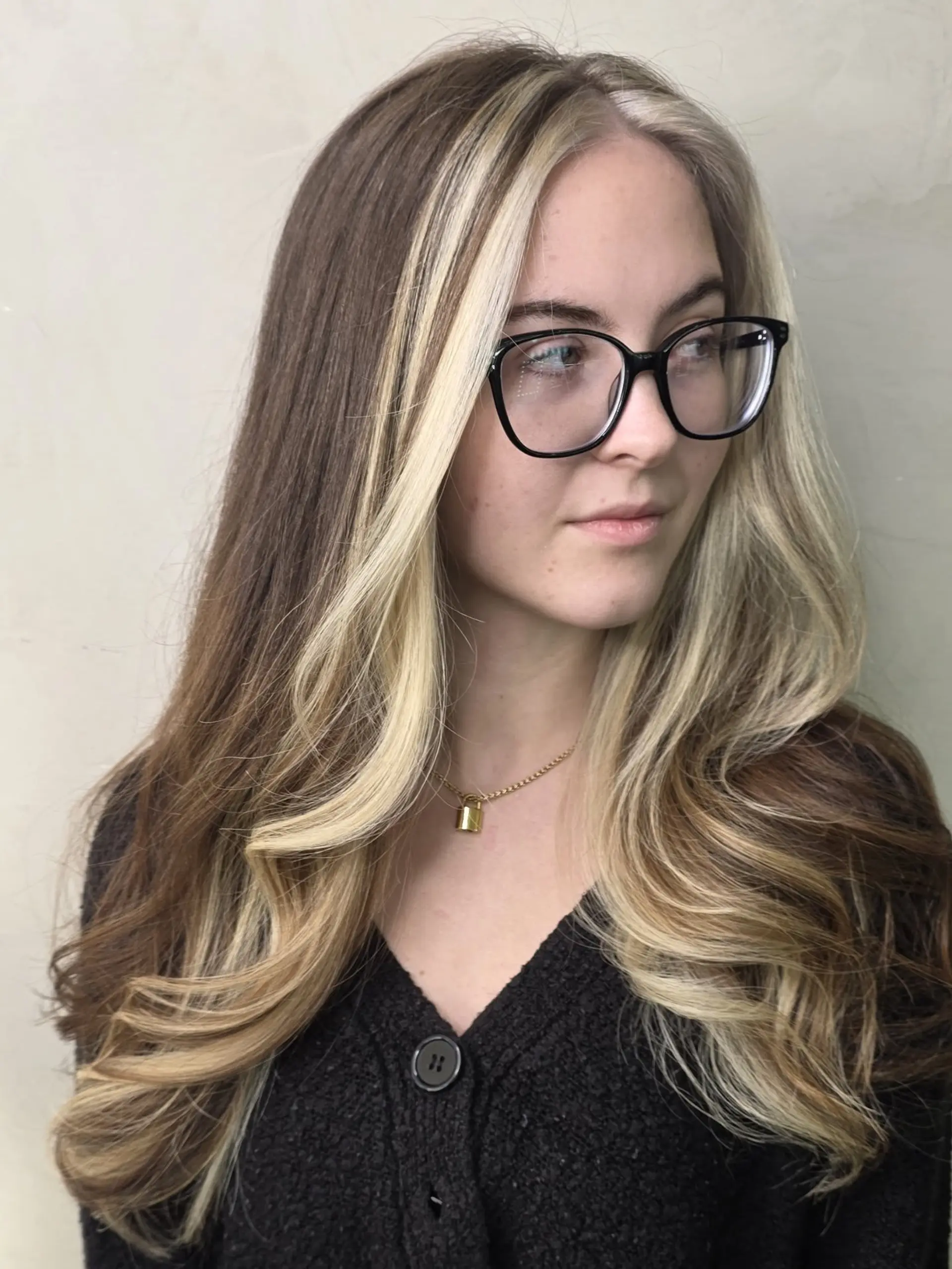 Long brown hair featuring bold blonde halo face-framing highlights with soft curled ends. 1