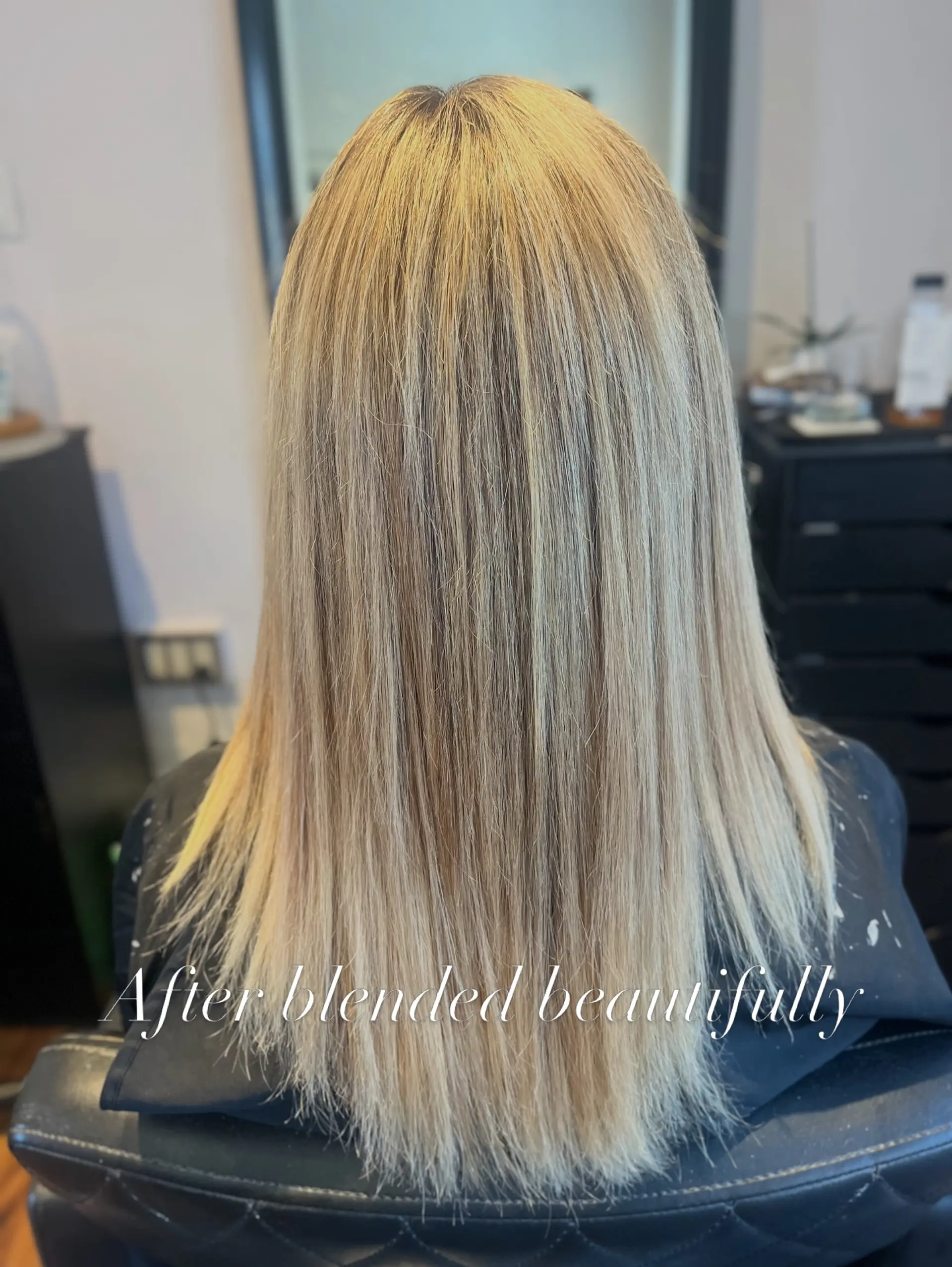 Straight, multi-tonal blonde hair seamlessly blended with extensions for natural-looking volume and length. 1