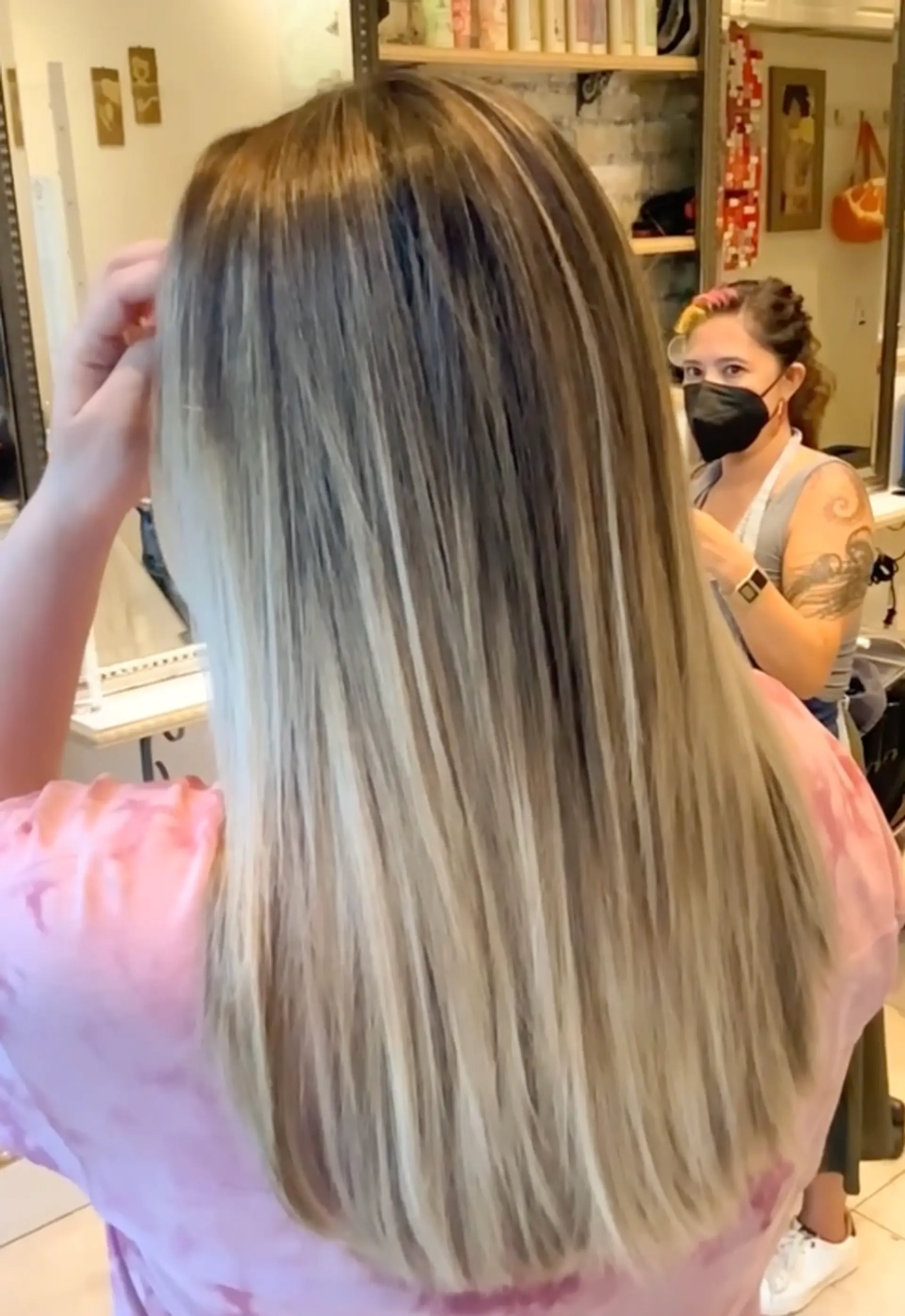 Long, straight hair with a balayage of ash blonde highlights and subtle layers. 1
