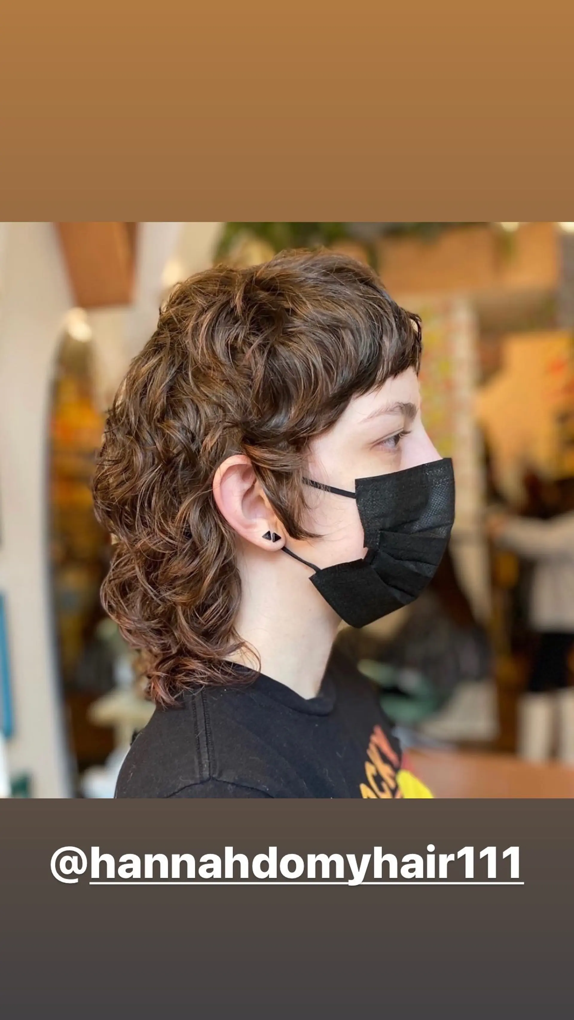 A modern take on the classic mullet, this style features short, curly layers at the crown blending into longer, wavier lengths in the back. 1