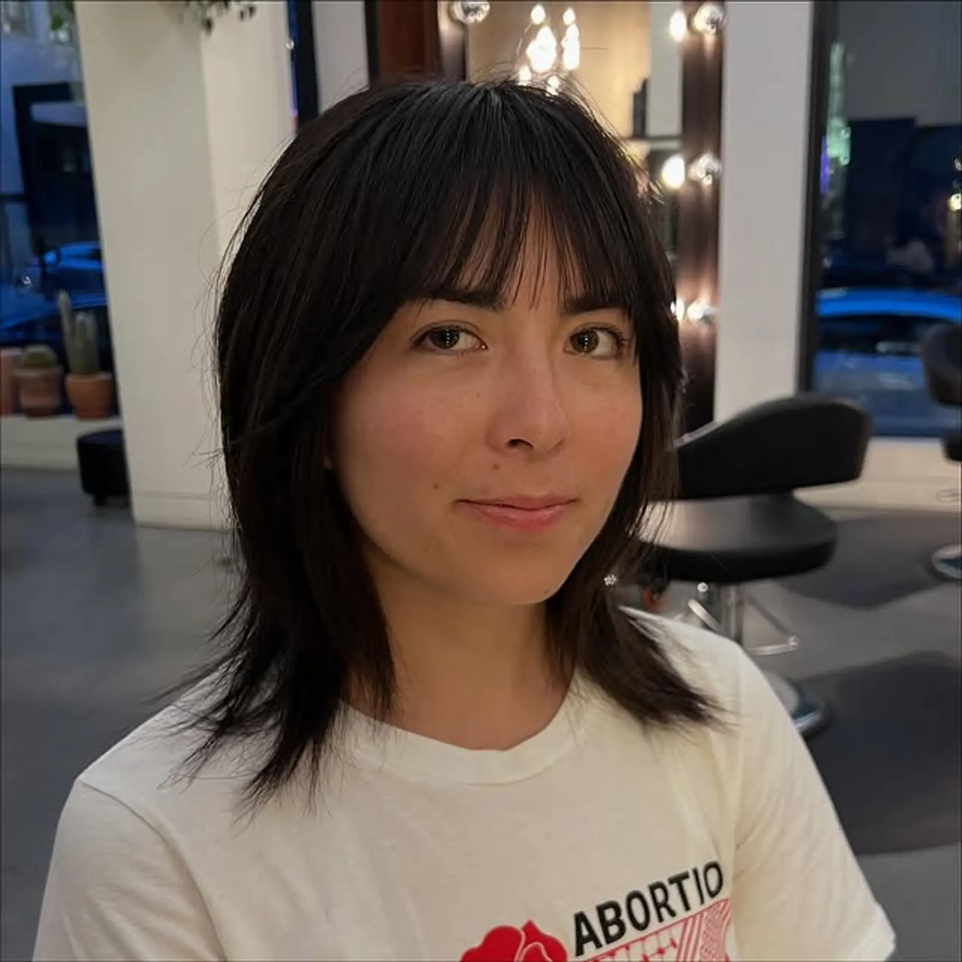 A choppy, layered shag with a fringe bang. 1