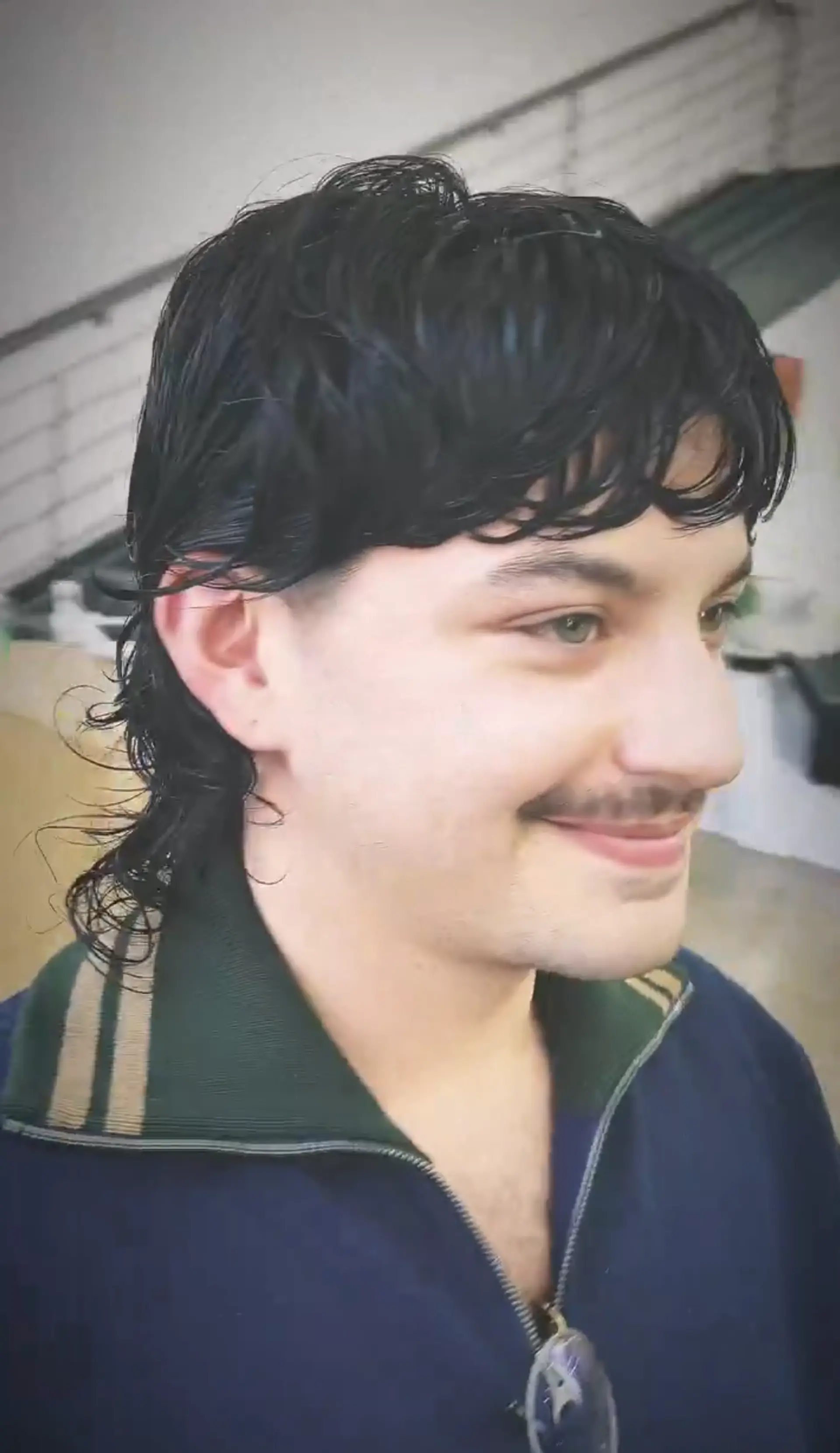 The hairstyle features a Modern Wave Mullet with medium-length, black wavy hair. The retro shag cut combines flowing wave elements with textured layers for a classic, chic look. 1