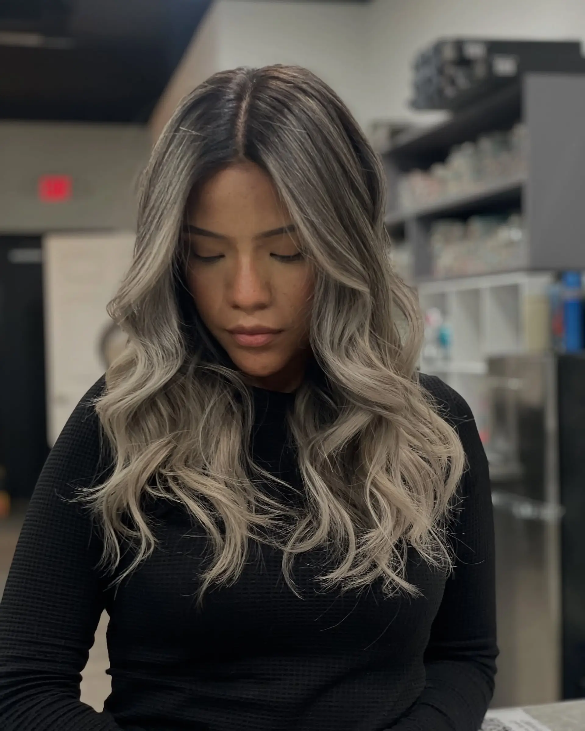 Long, wavy hairstyle with an ash blonde balayage ombre effect. 2