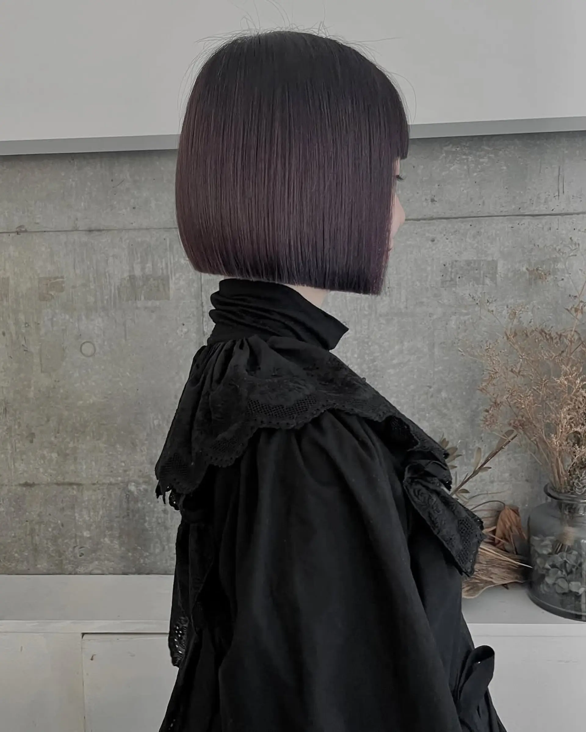 A precision-cut sleek bob with blunt ends and a smooth finish, offering a modern and minimalist look. 1