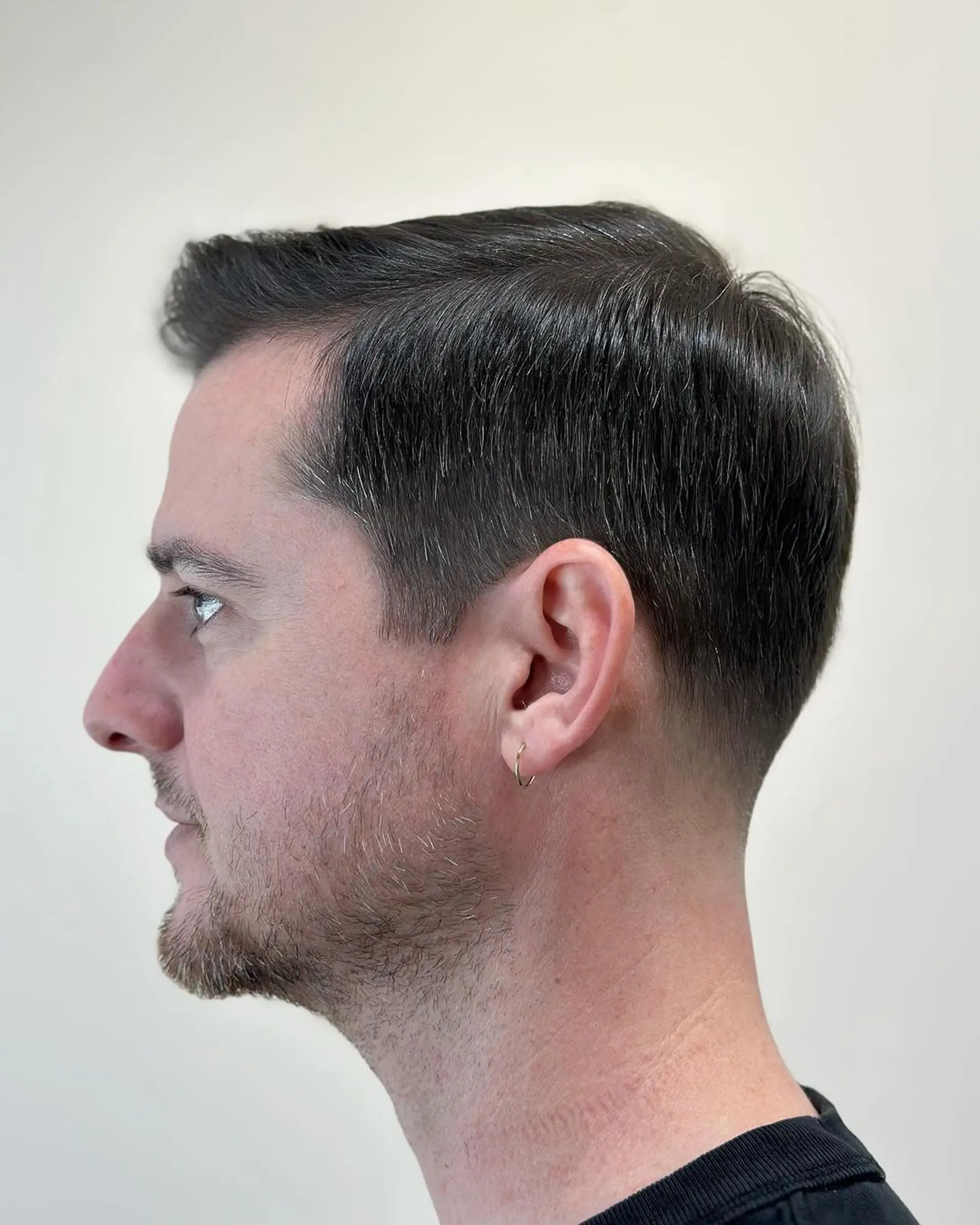 A sophisticated short haircut with a classic side part and tapered fade, ideal for a polished and professional look. 2