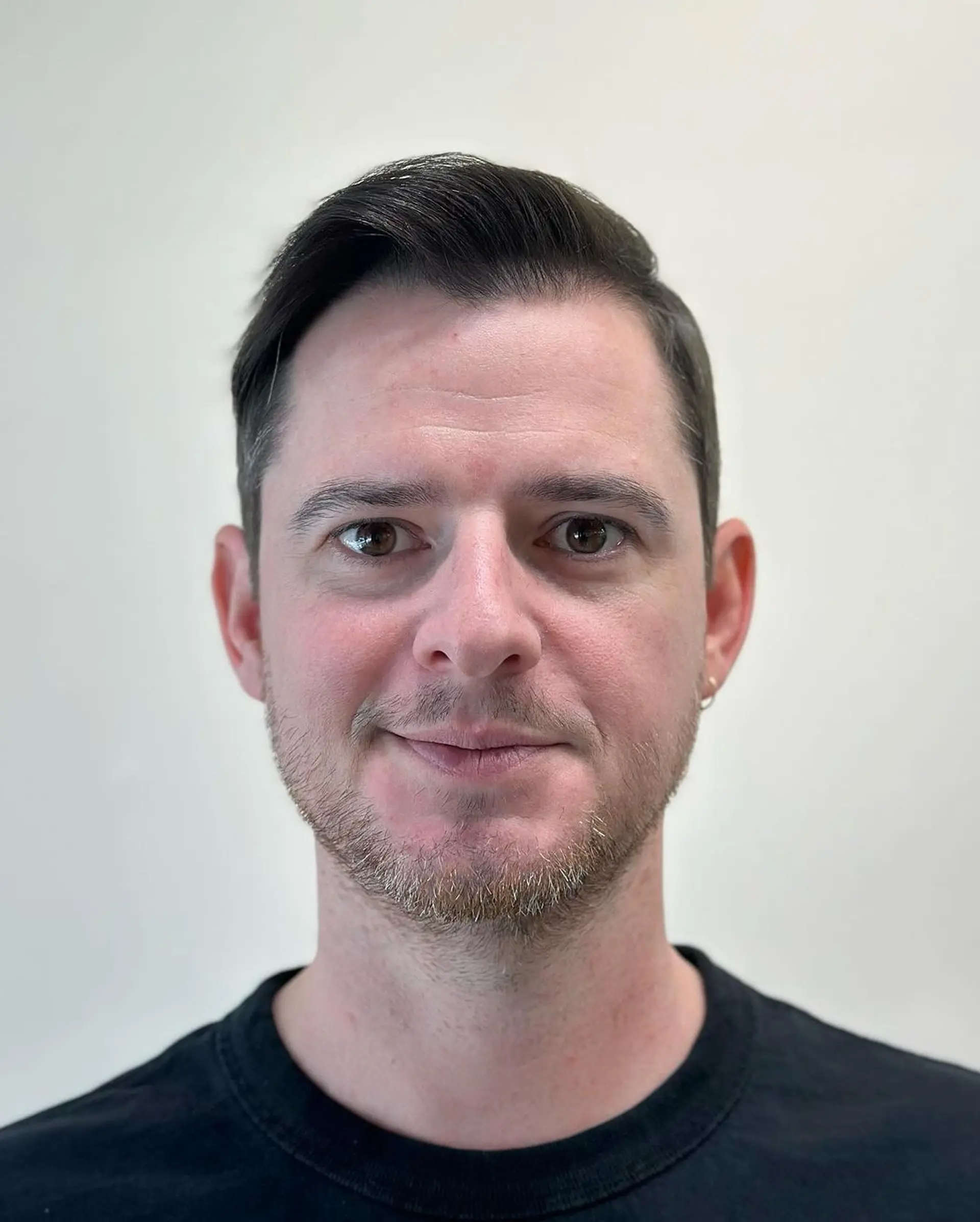 A sophisticated short haircut with a classic side part and tapered fade, ideal for a polished and professional look. 3