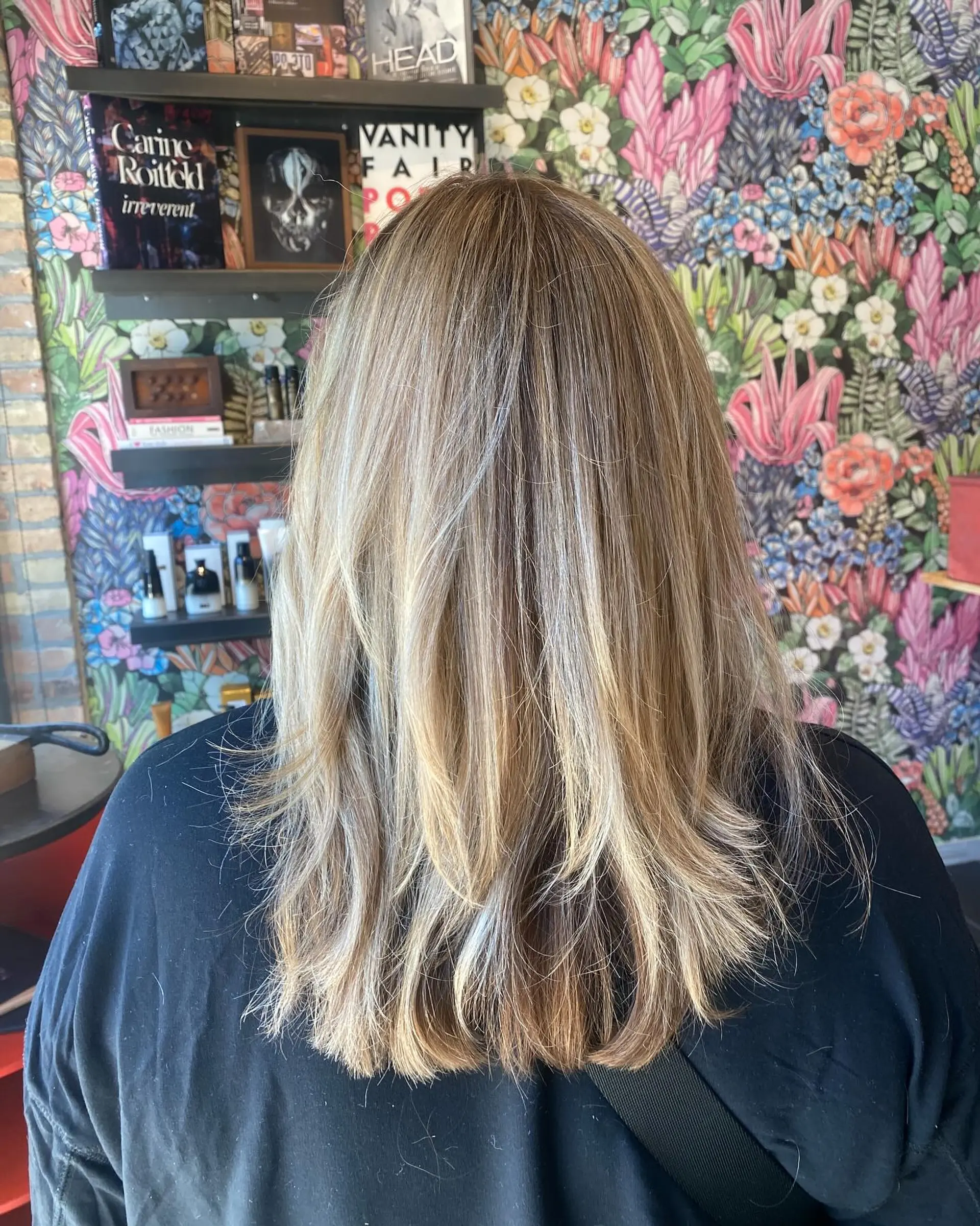 A medium-length layered hairstyle with a Bronde Balayage. 1