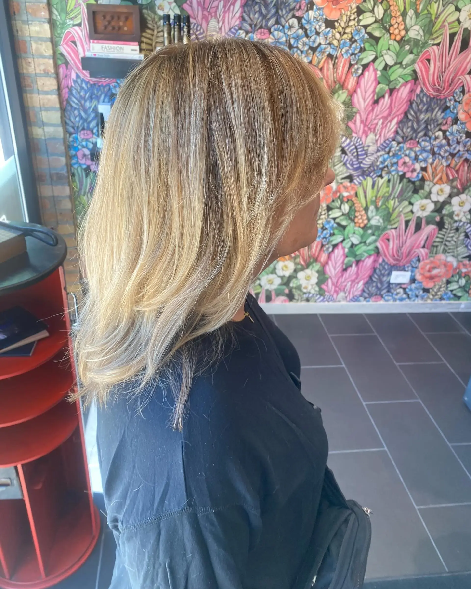 A medium-length layered hairstyle with a Bronde Balayage. 2
