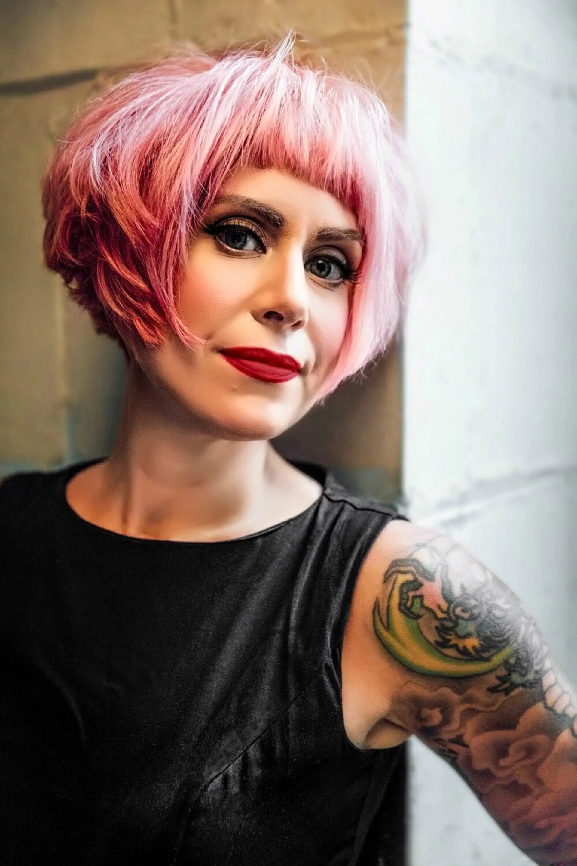 A short, textured pixie bob with blunt bangs. 1