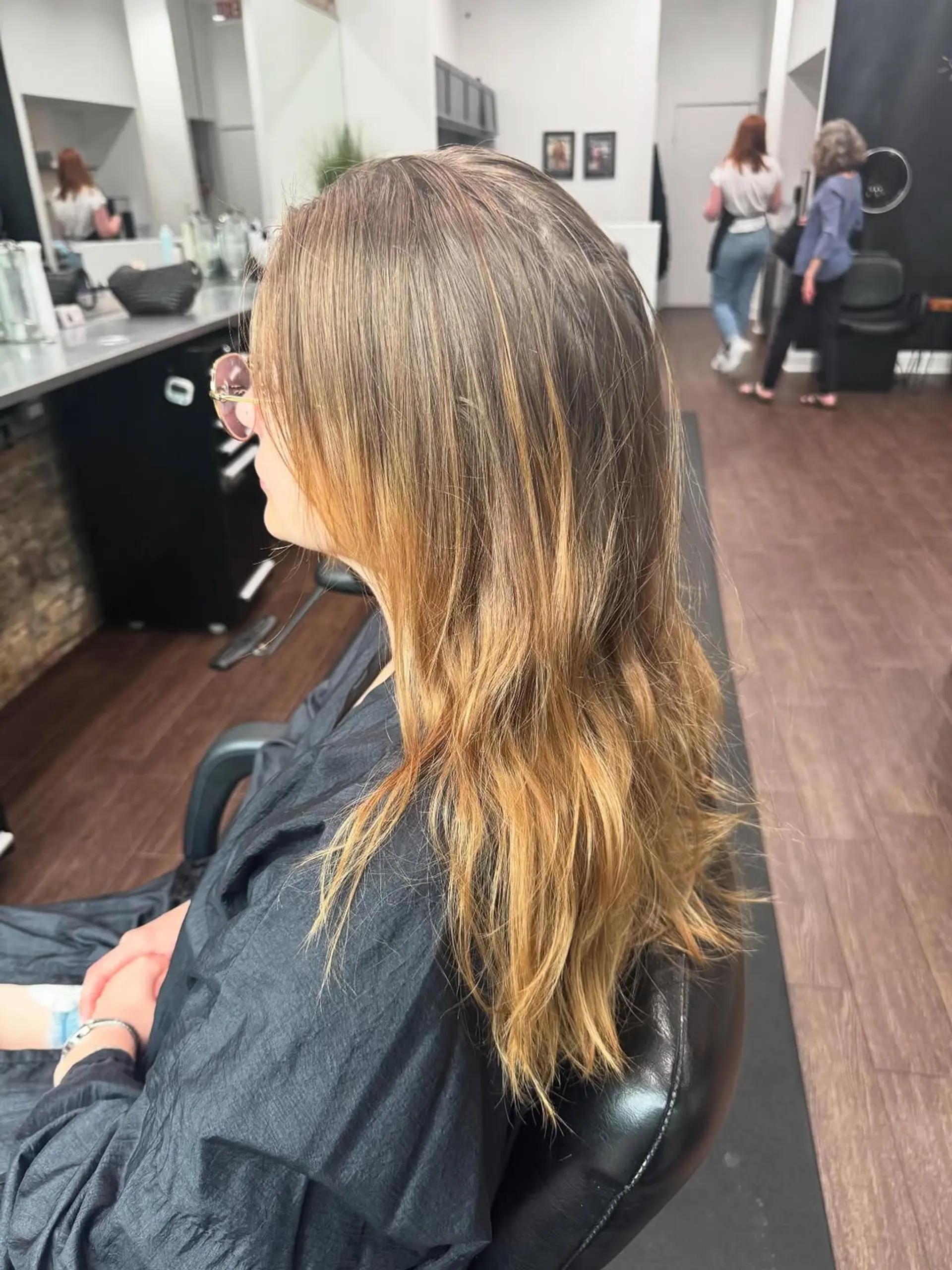 A sleek, short layered bob with a vibrant split-dye or multi-tonal color application featuring bold shades of fuchsia, hot pink, and magenta. 2