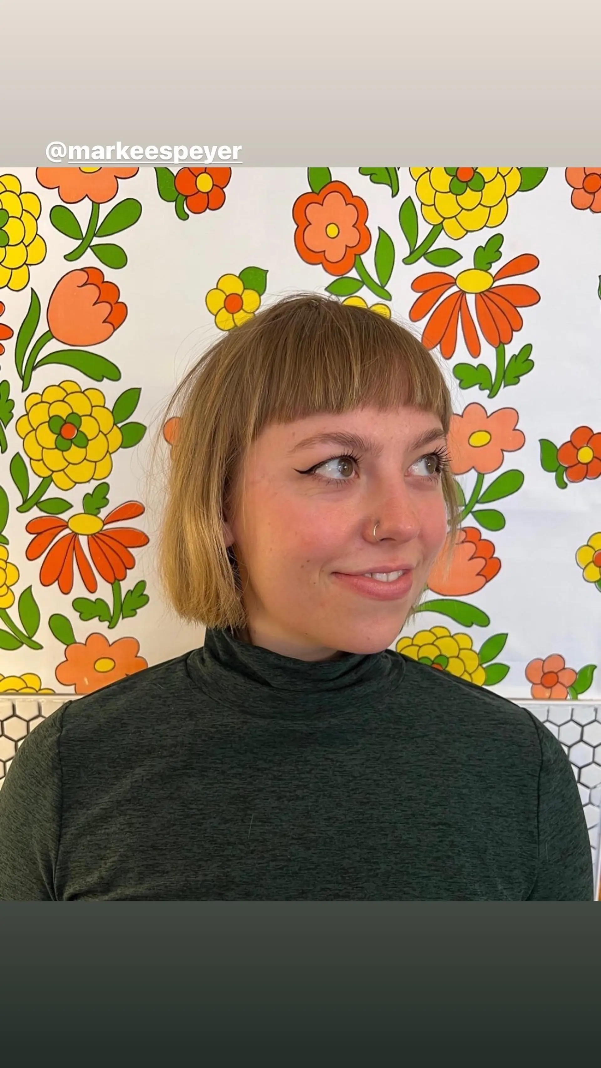 A chin-length blunt bob with short, baby bangs. 1