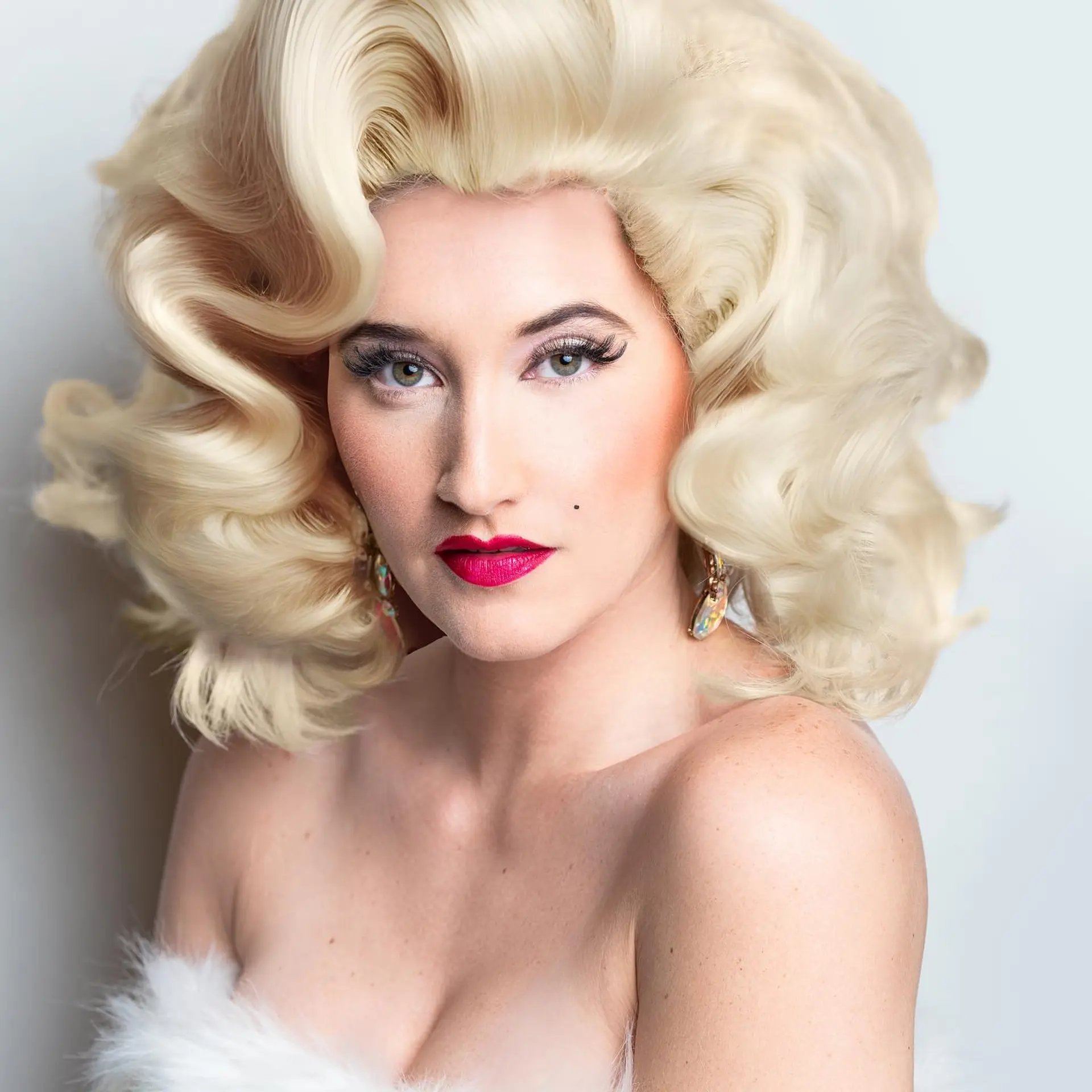 High-volume, retro-styled Hollywood curls in an icy platinum blonde finish. 1