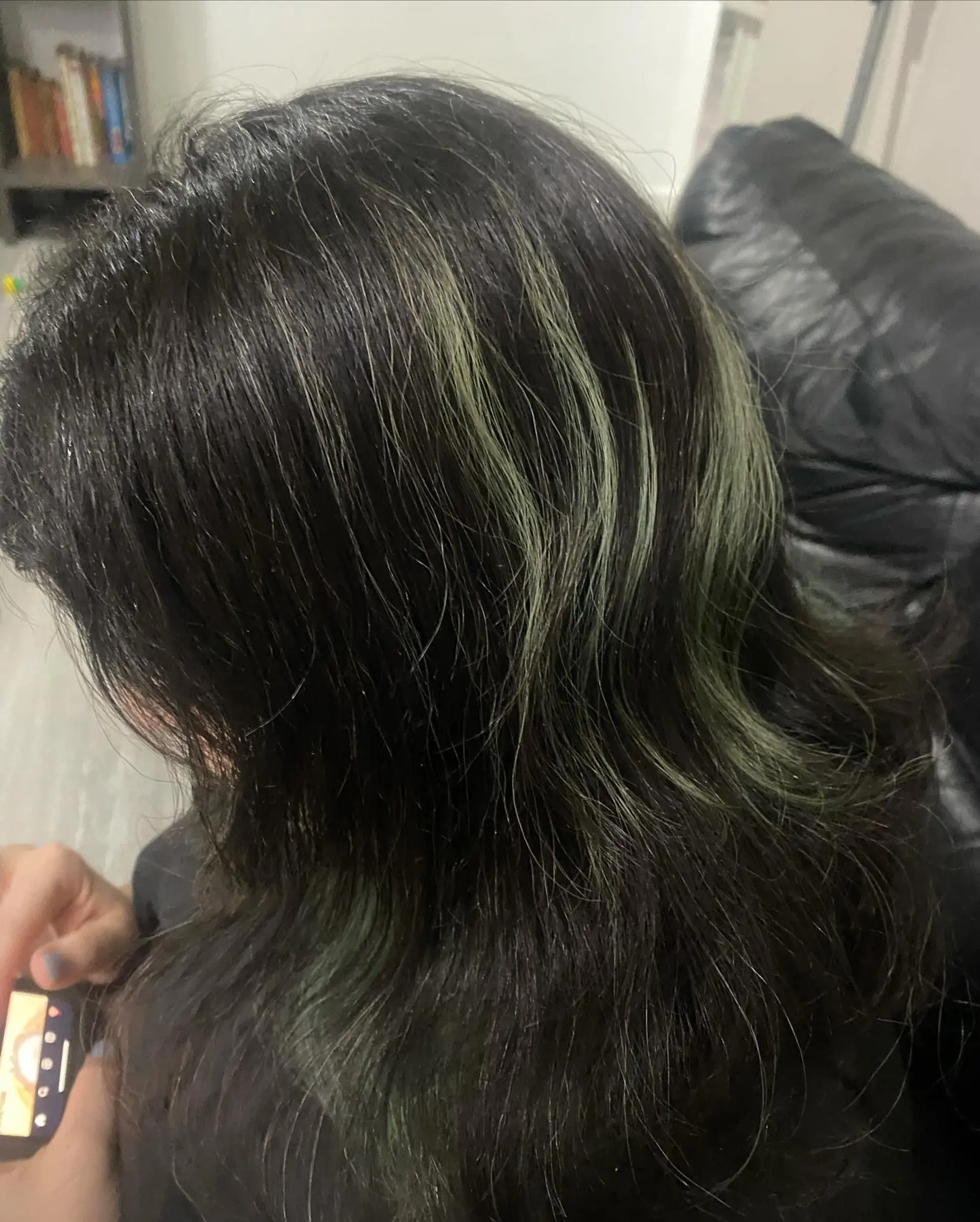 Medium-length dark wavy hair accented with chunky muted blue highlights. 1