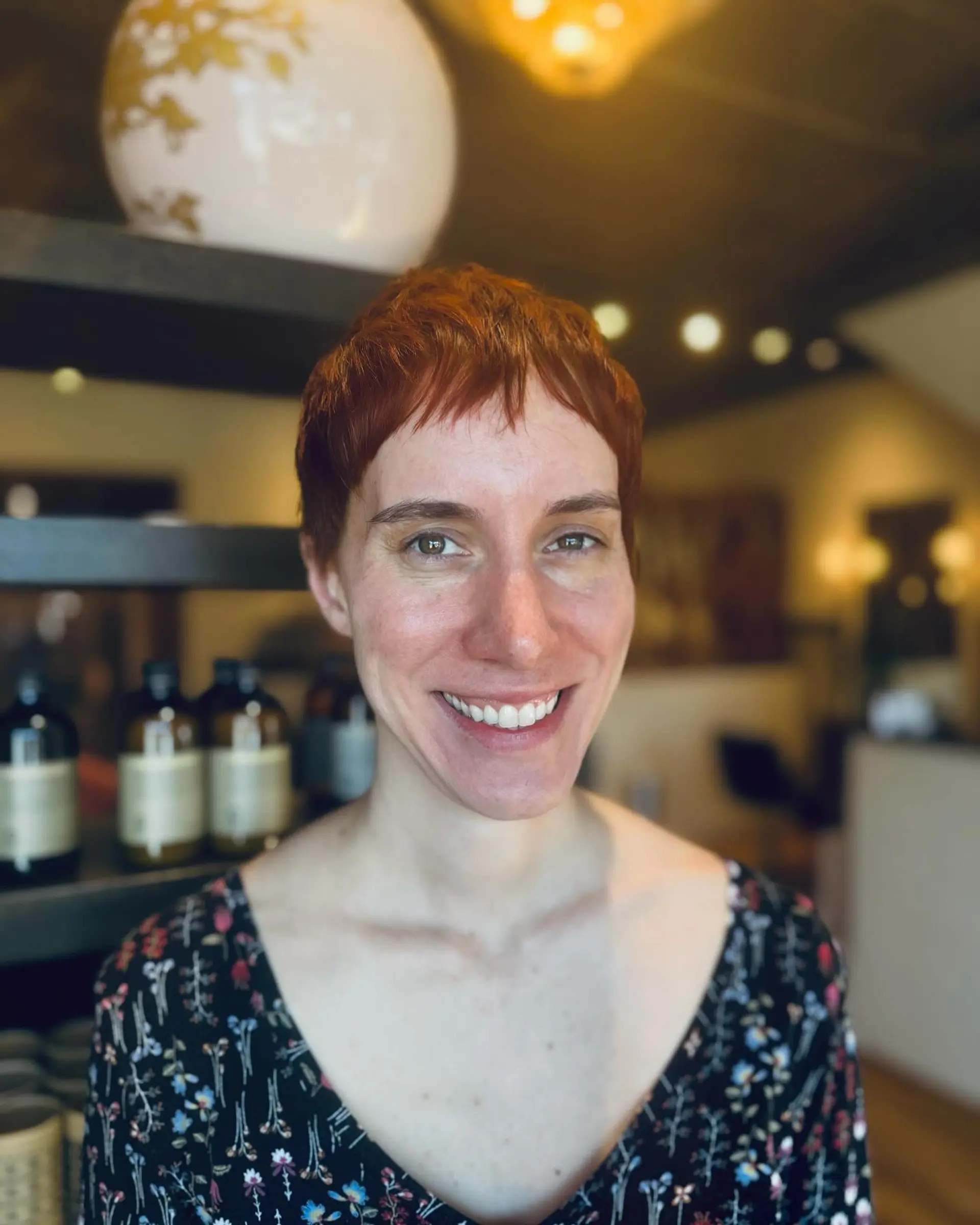 A short, copper-colored pixie cut with texture. 1