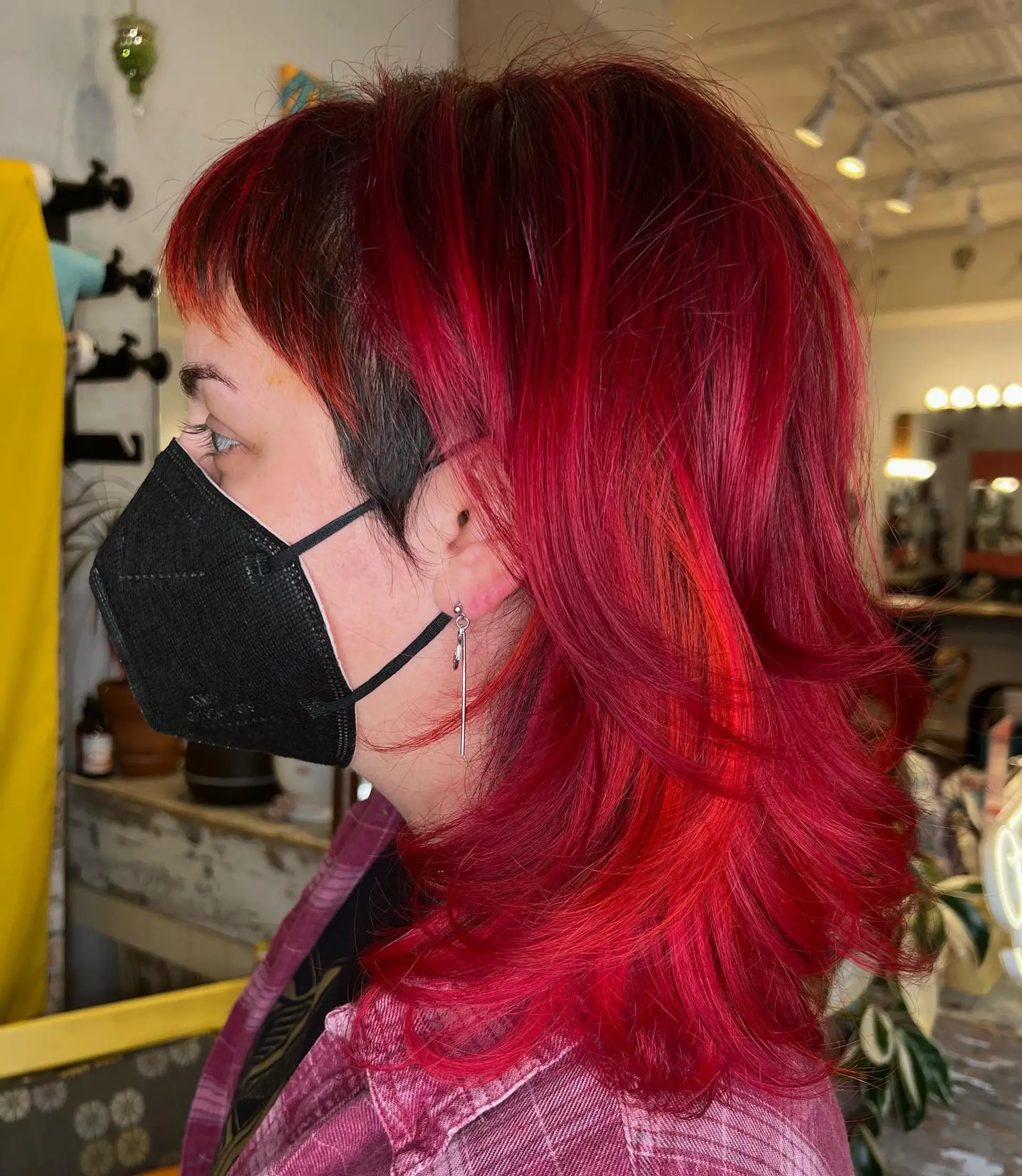 A medium-length shag with short, choppy baby bangs and lots of textured layers. 1