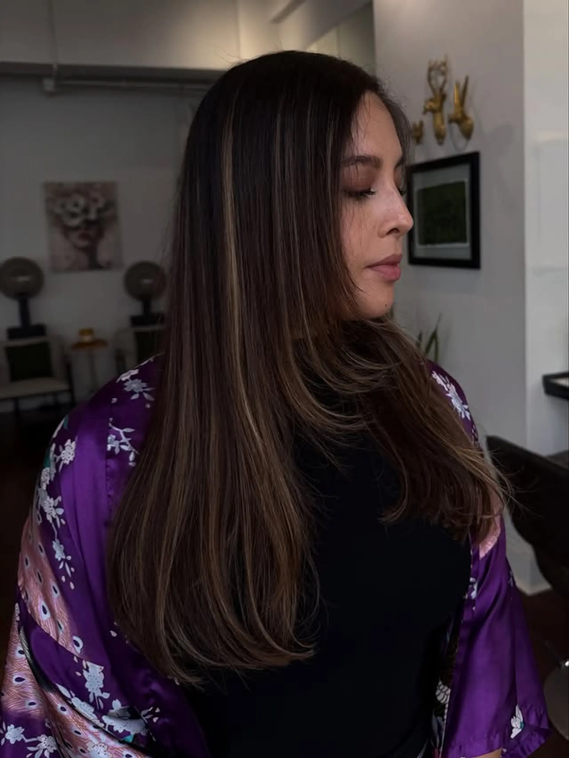 Long layered hairstyle with face-framing layers and highlights. 1