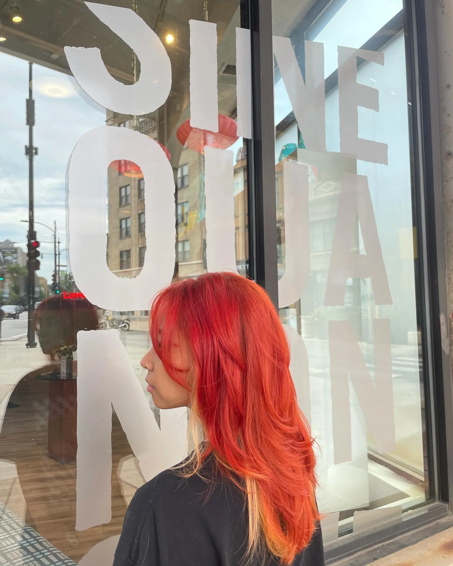 Long straight hair with a bold money piece highlight style, featuring red and copper tones. 3