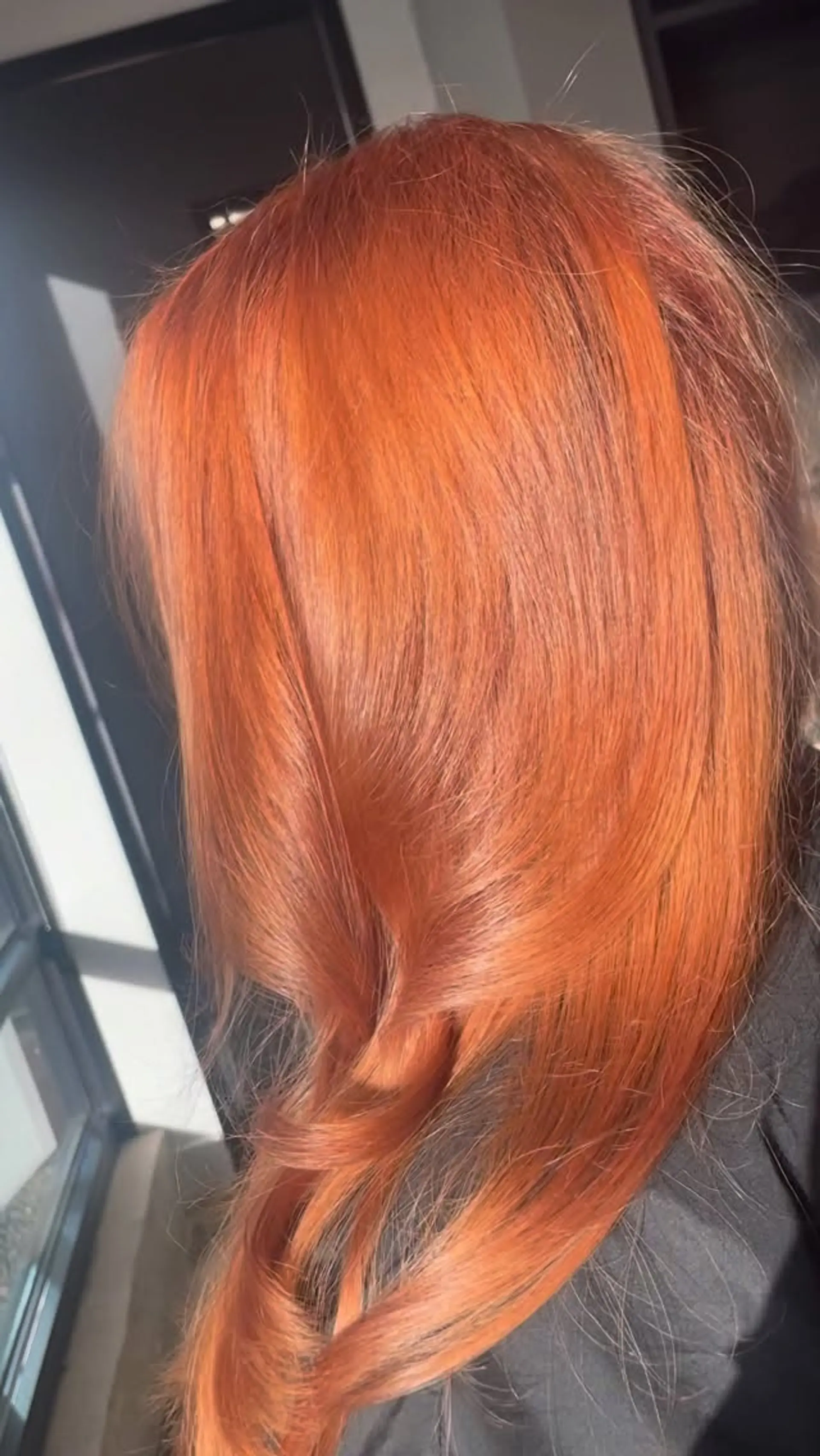 Rich strawberry copper hair with smooth texture and soft bent ends. 1