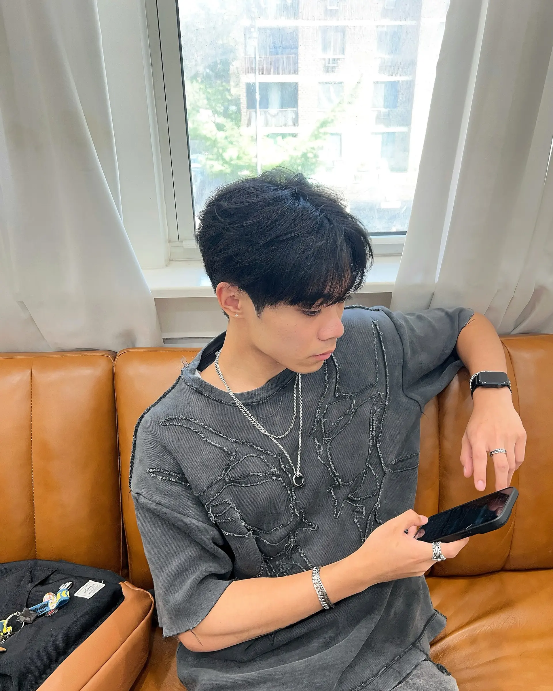 Short, textured hairstyle with a soft, tousled look. 2