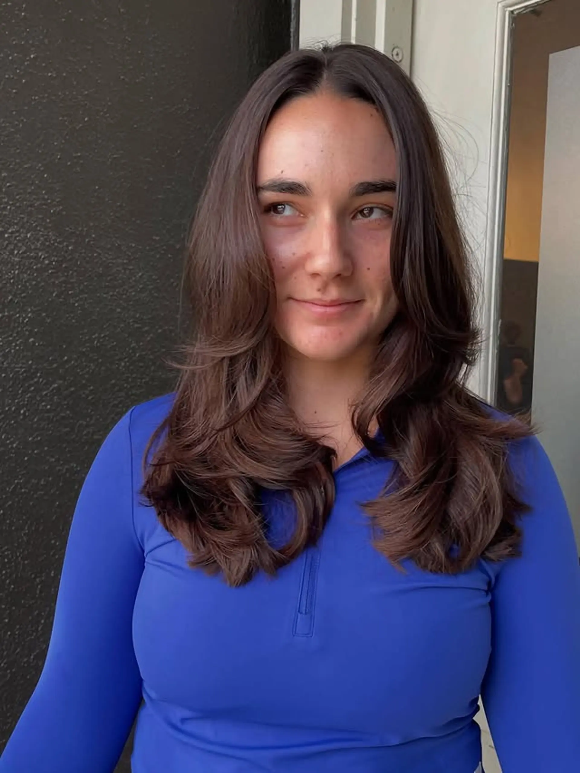 Long, layered haircut with face-framing layers and soft waves. 1