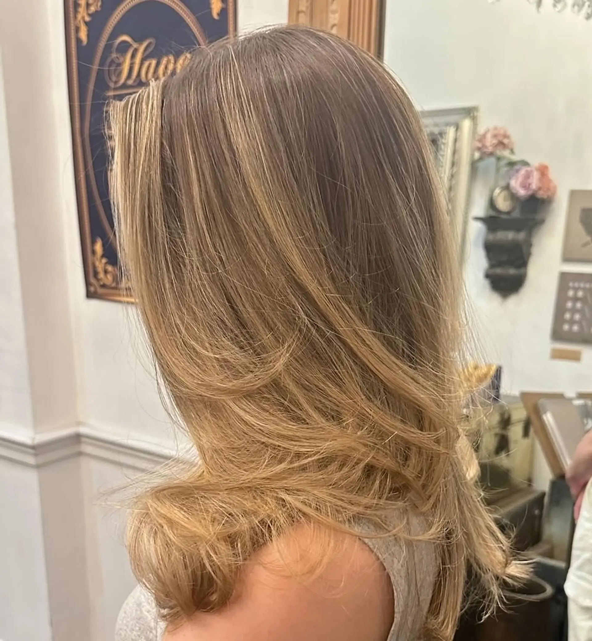 Long, straight hair with natural blonde to light brown gradient, featuring soft, voluminous layers and gentle waves at the ends. 2