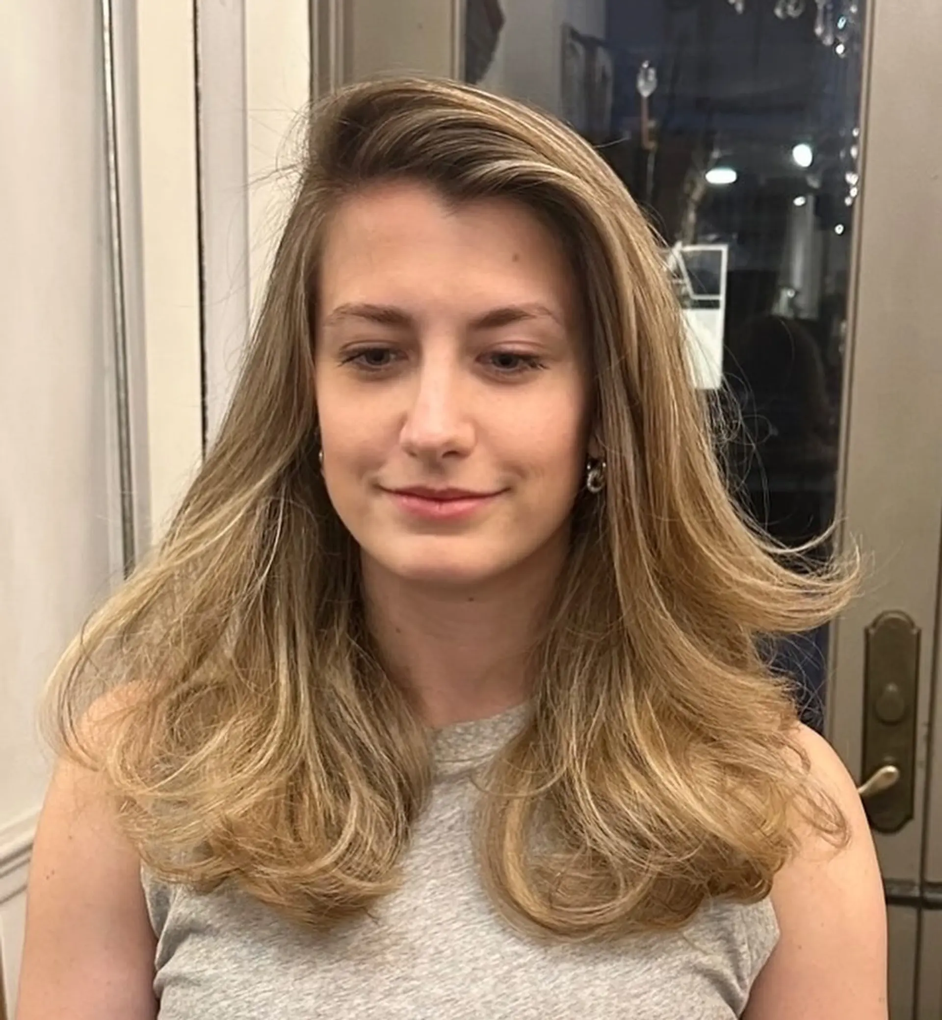 Long, straight hair with natural blonde to light brown gradient, featuring soft, voluminous layers and gentle waves at the ends. 3