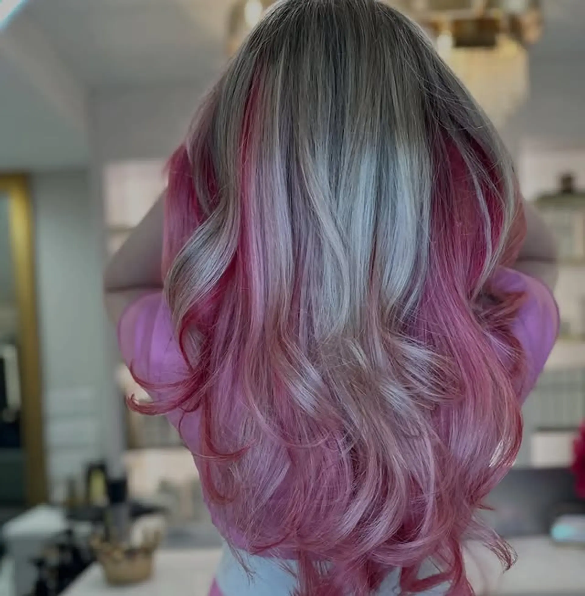 Long wavy hair with a pink ombre balayage. 1