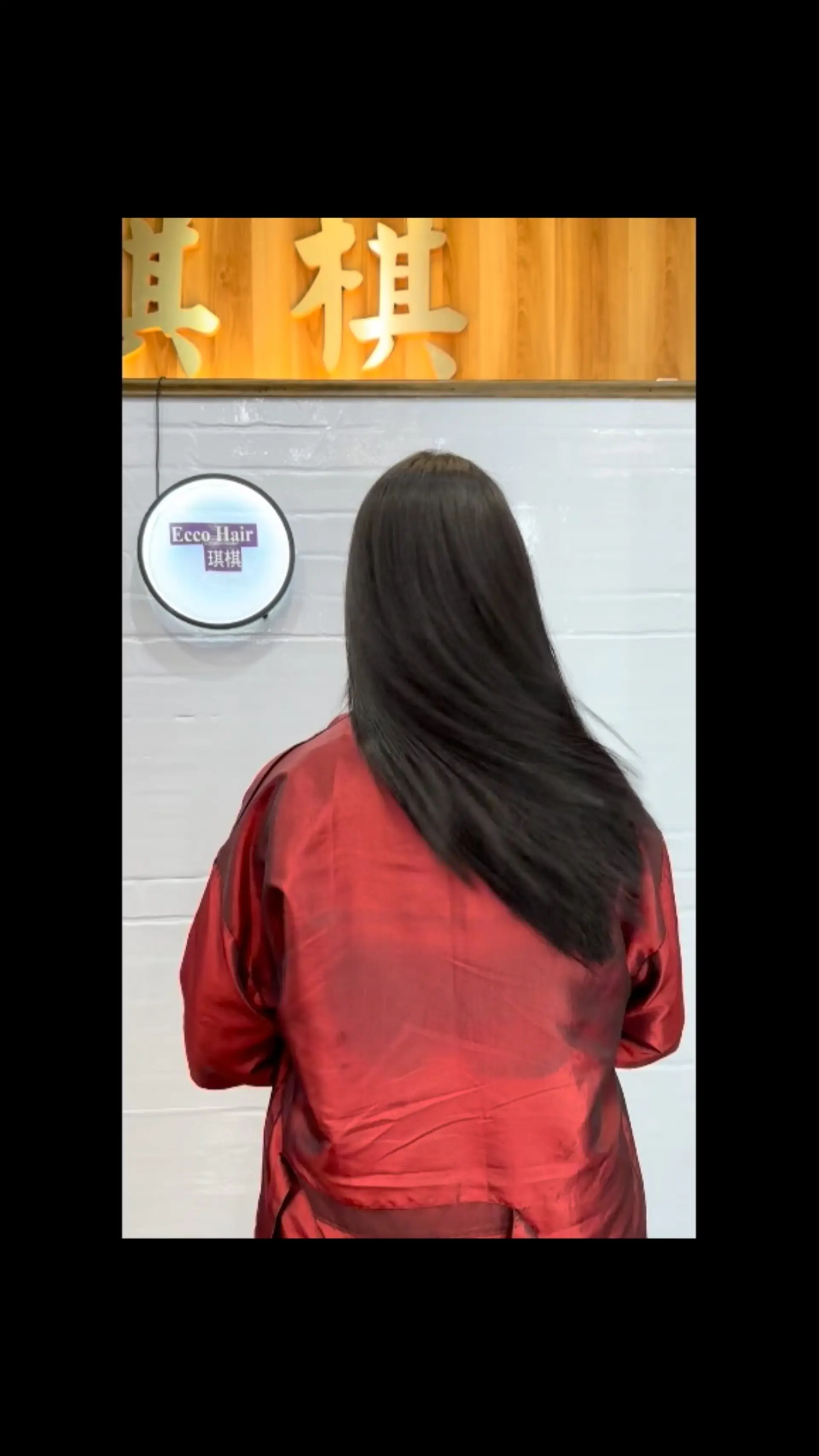 Long, silky straight dark hair with a sleek, frizz-free texture cascading down the back. 1
