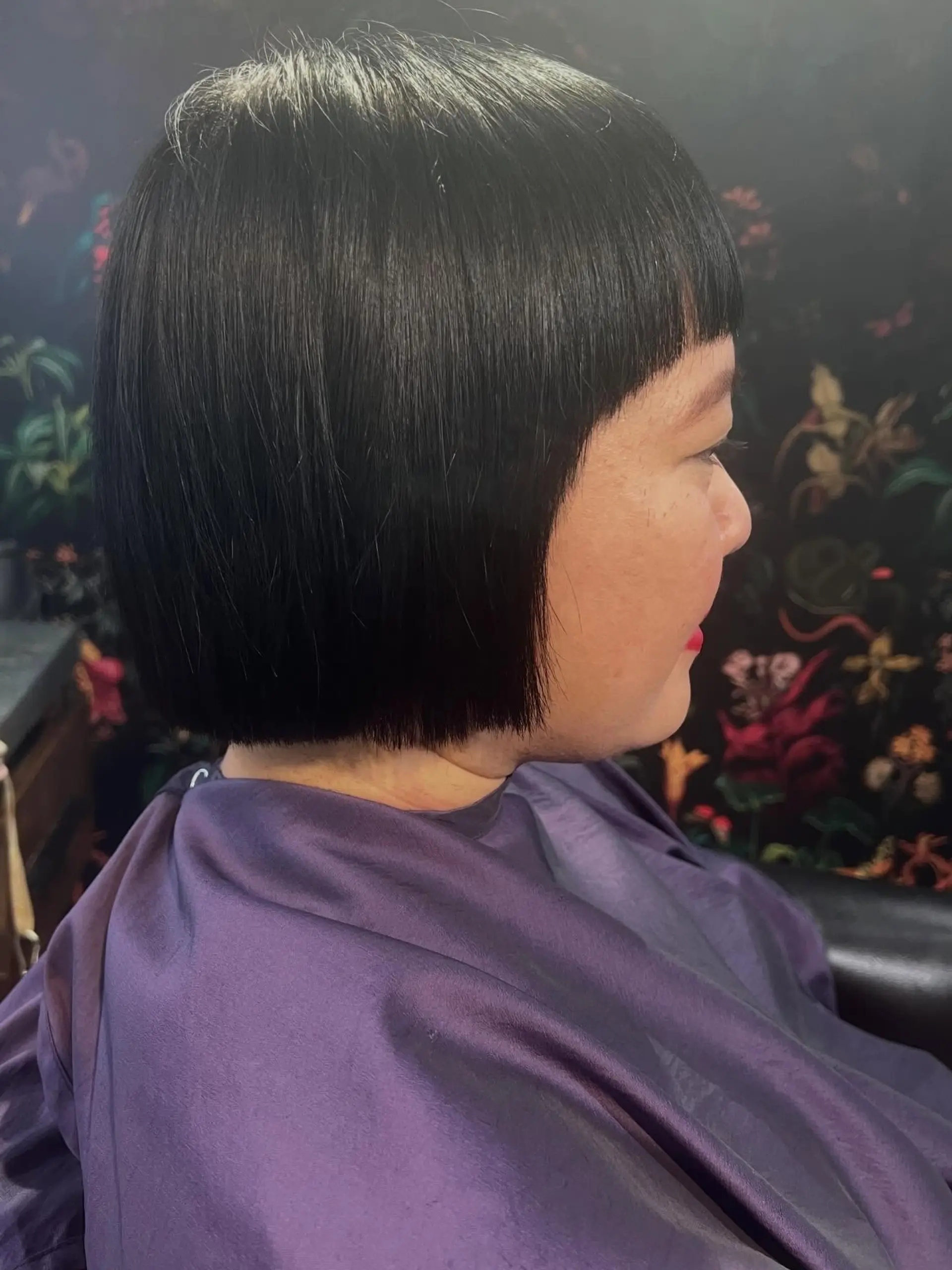 A sleek, chin-length blunt bob haircut paired with straight micro bangs. 1