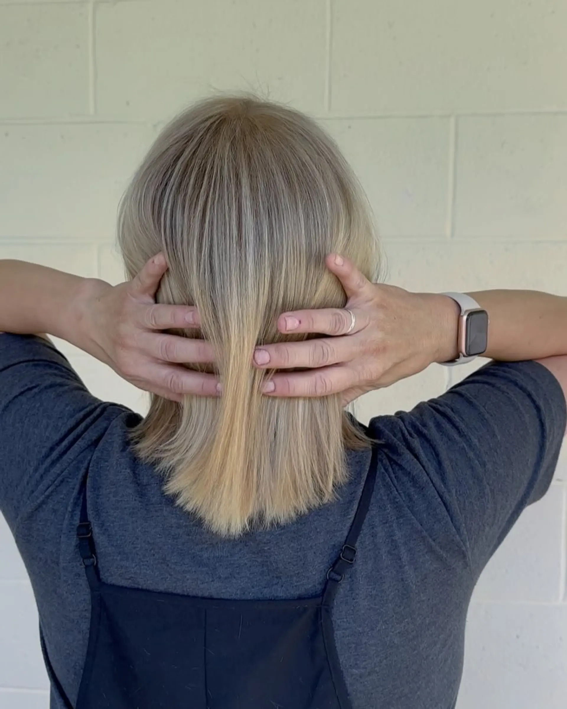 A straight, collar-length blonde bob featuring dimensional highlights and clean, soft-textured ends. 1