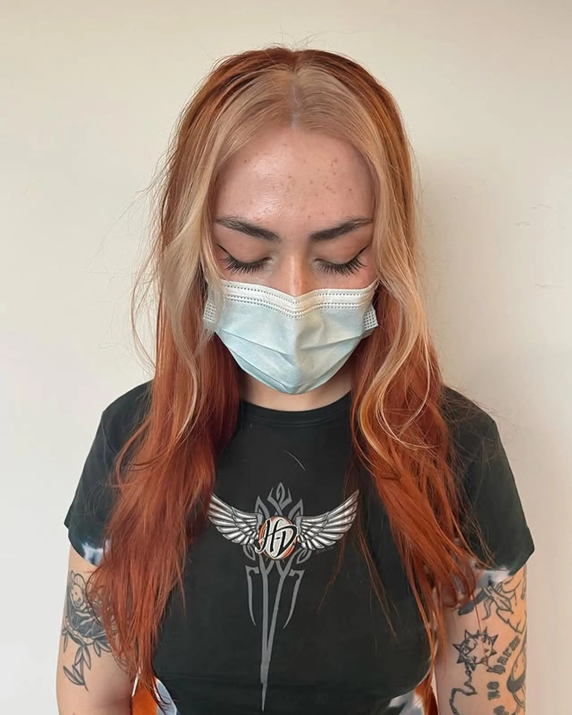 Long wavy hair with bold face-framing blonde highlights on a ginger base. 1