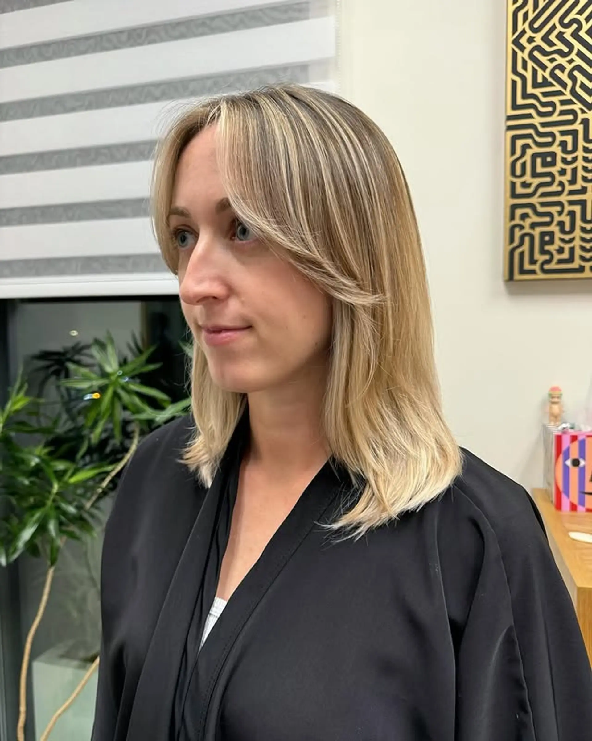 Medium length hair with curtain bangs and soft, face-framing layers. 1