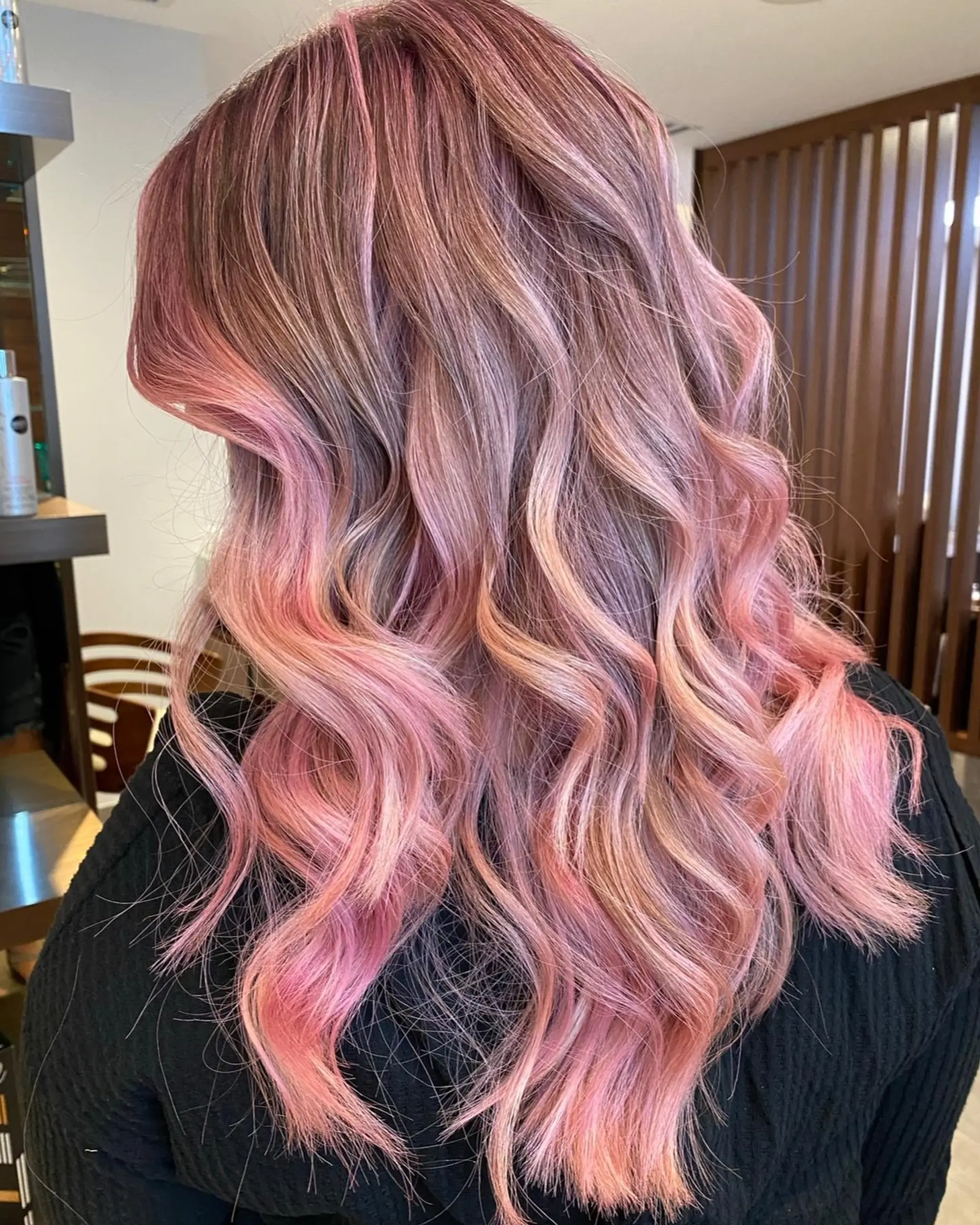 Long wavy hair with a strawberry pink balayage. 1