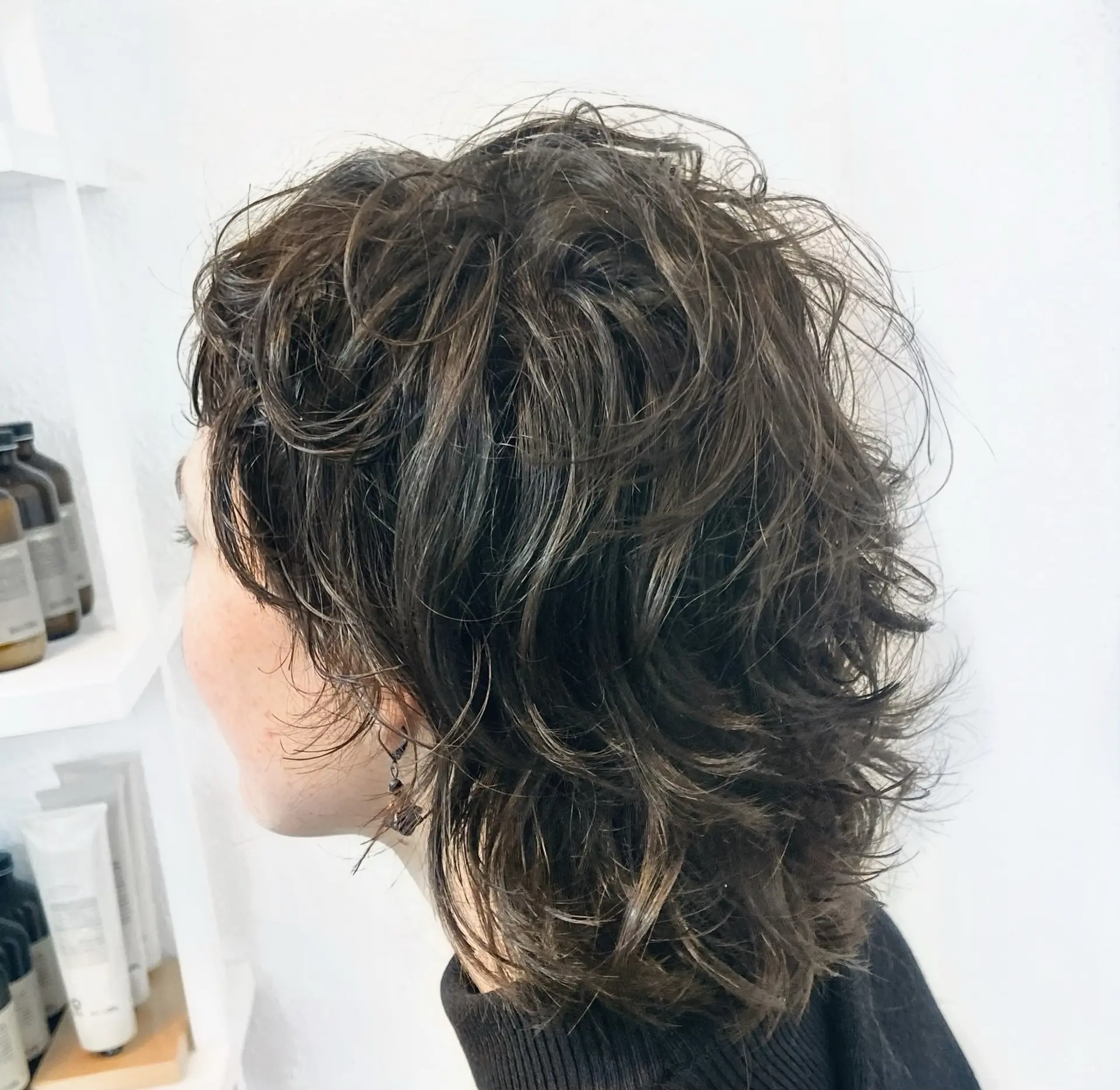 A textured wavy shag cut featuring heavy, choppy layers and effortless volume. 1