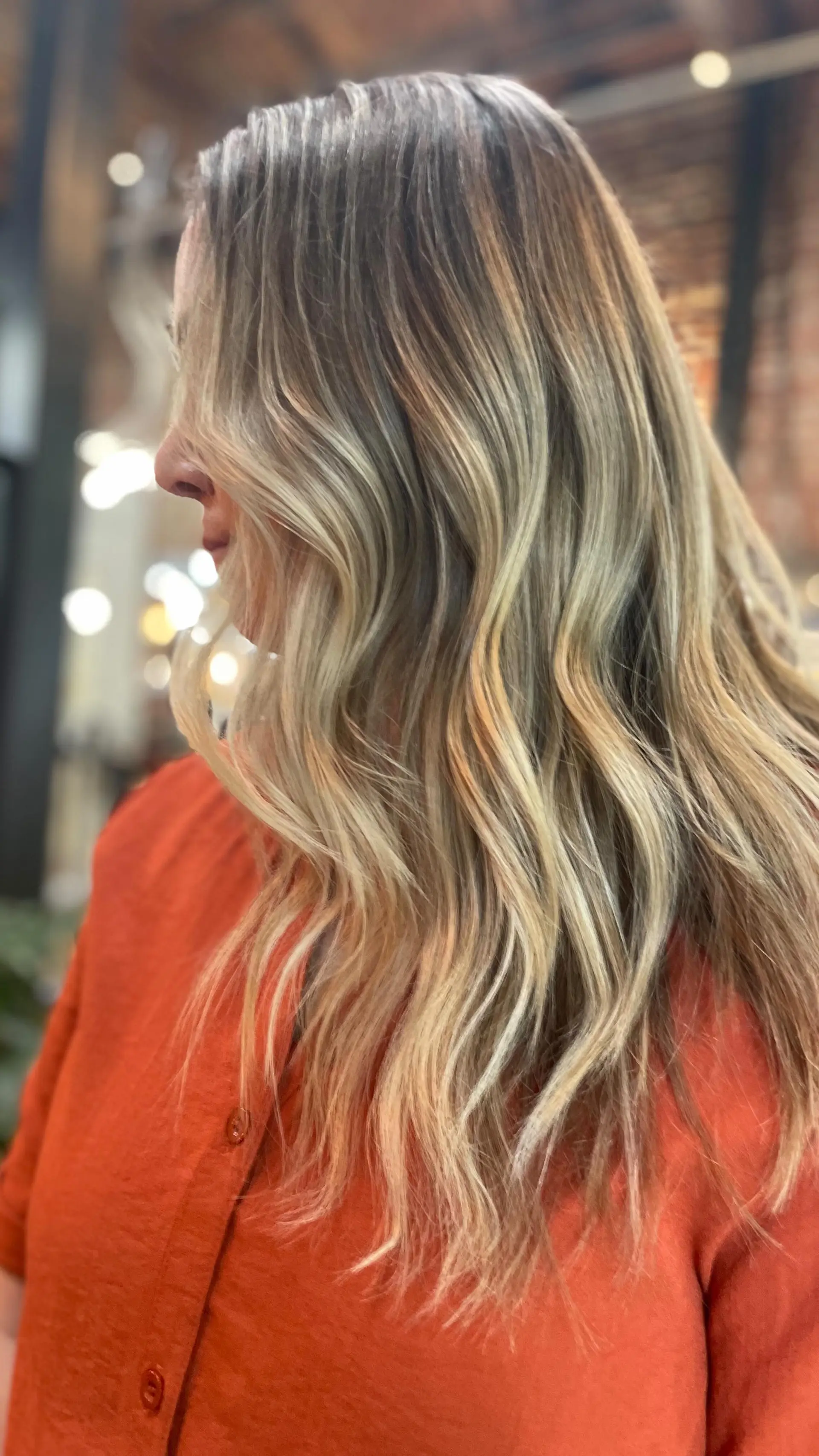 Long dimensional blonde hair styled in soft, undone waves. 1