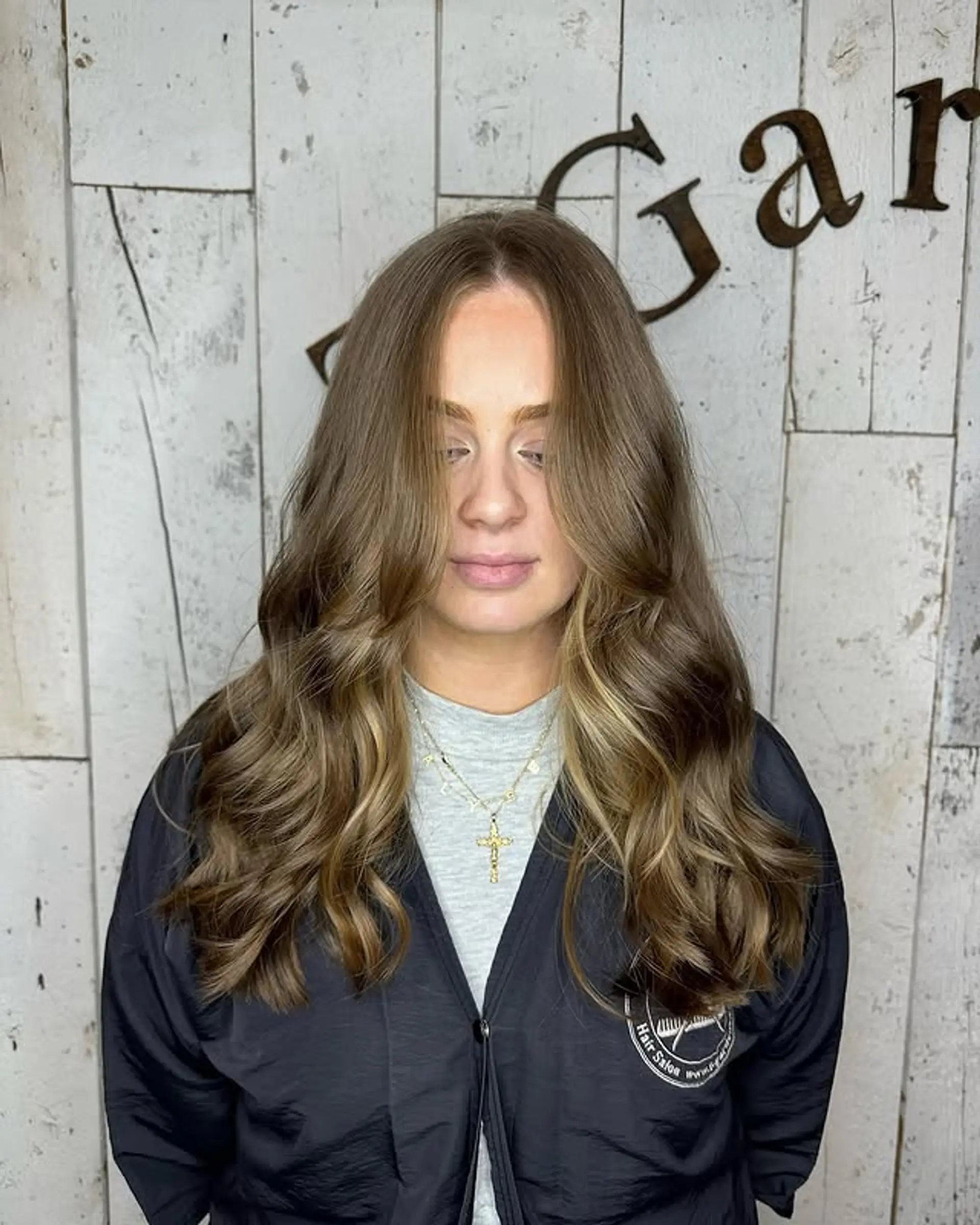 Long, layered wavy hair with caramel balayage. 1