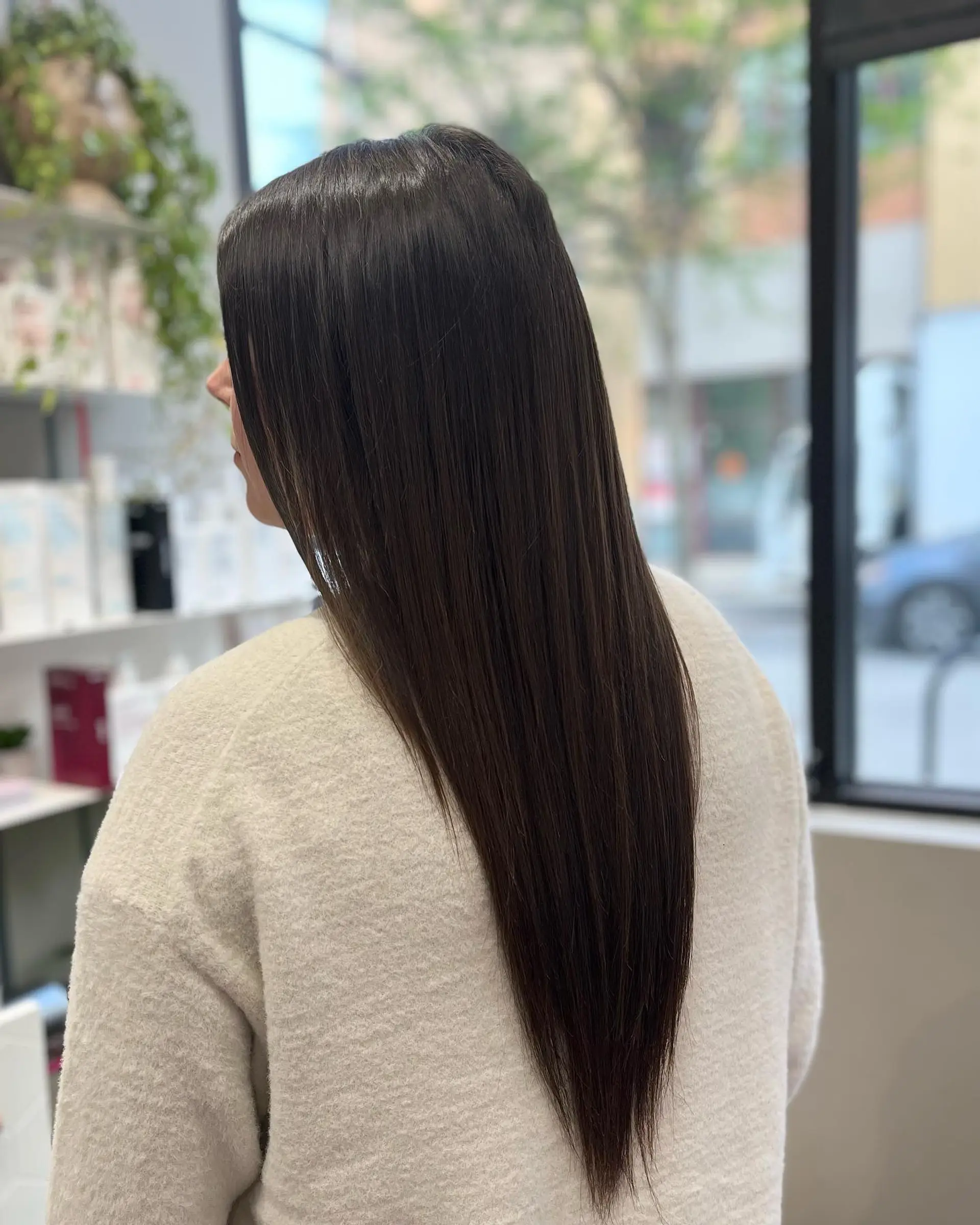 A sleek, straight, long hairstyle with a V-cut. 1