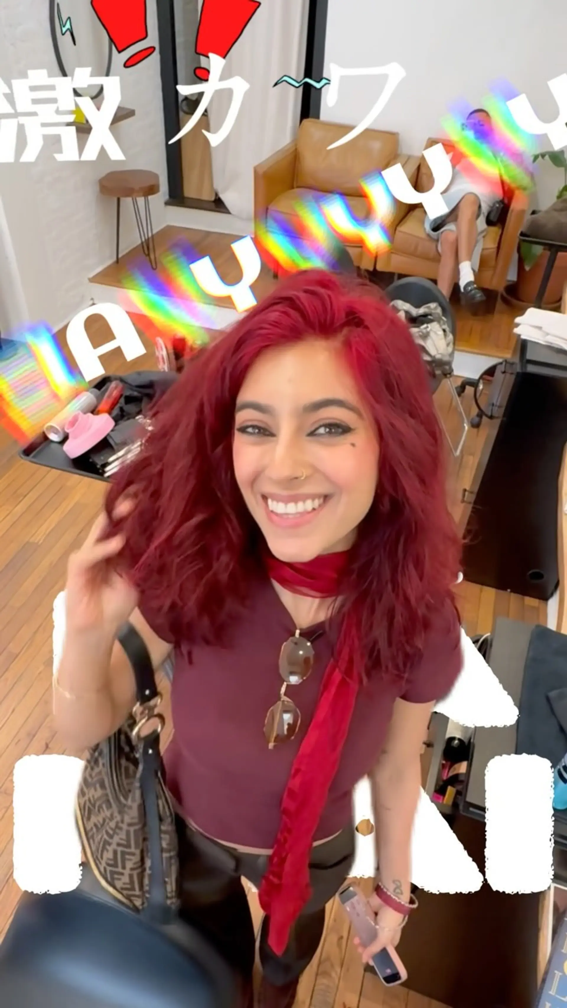 Medium-length vibrant crimson red hair cut with soft textured layers and styled in voluminous waves. 1