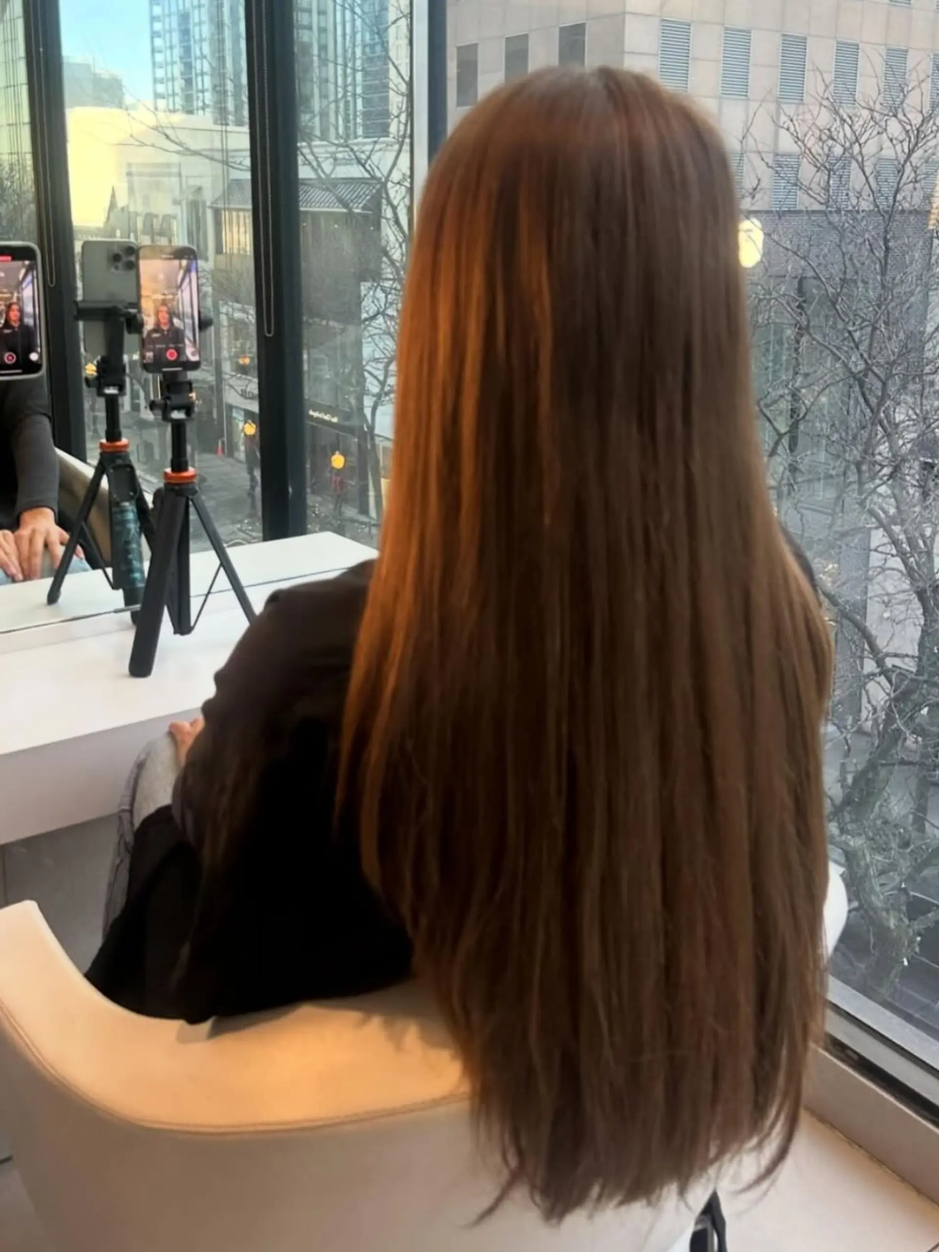 Extra-long, straight chocolate brown hair styled smooth and sleek cascading down the back. 1