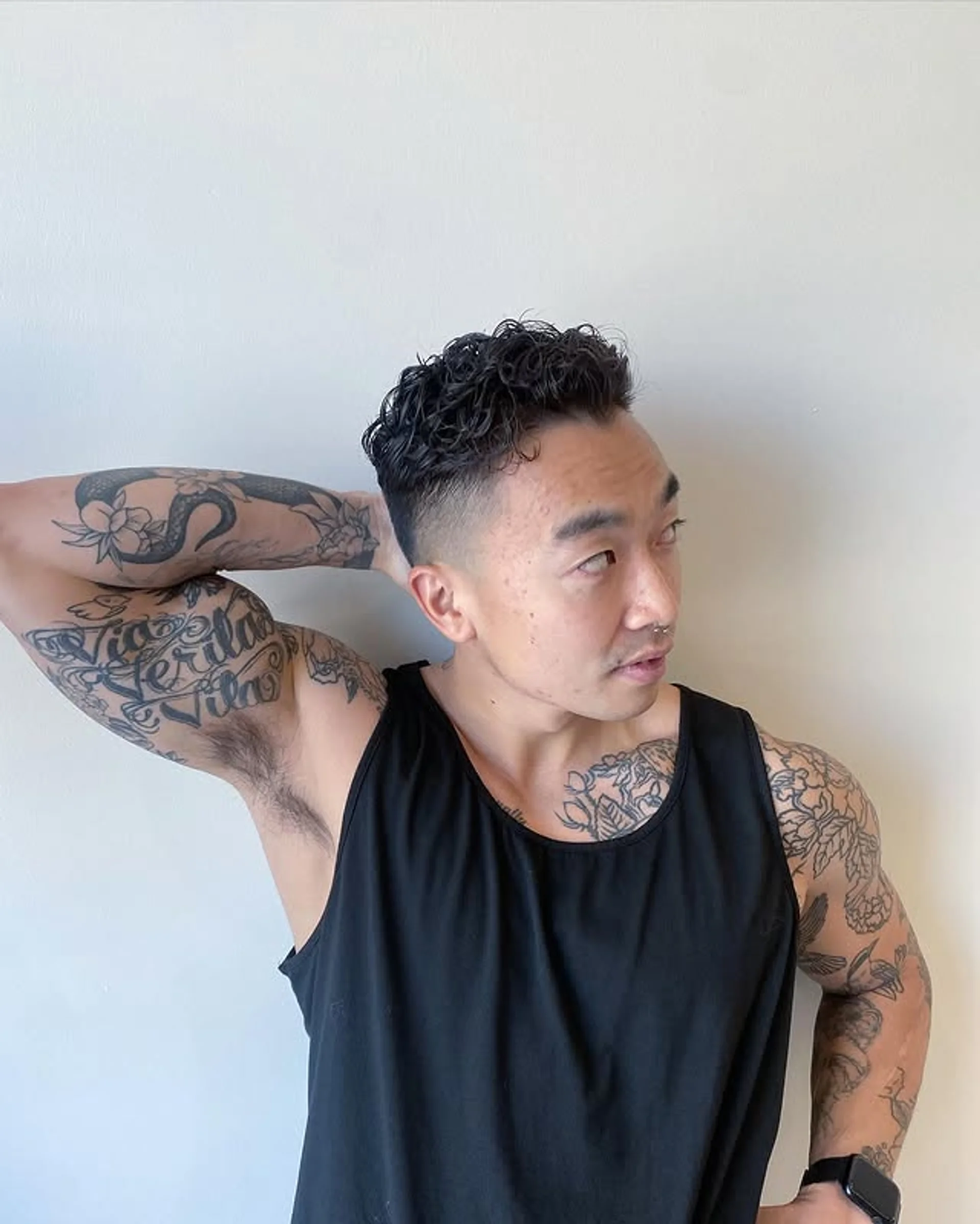 Modern men's perm with textured waves and volume on top - Preview 2