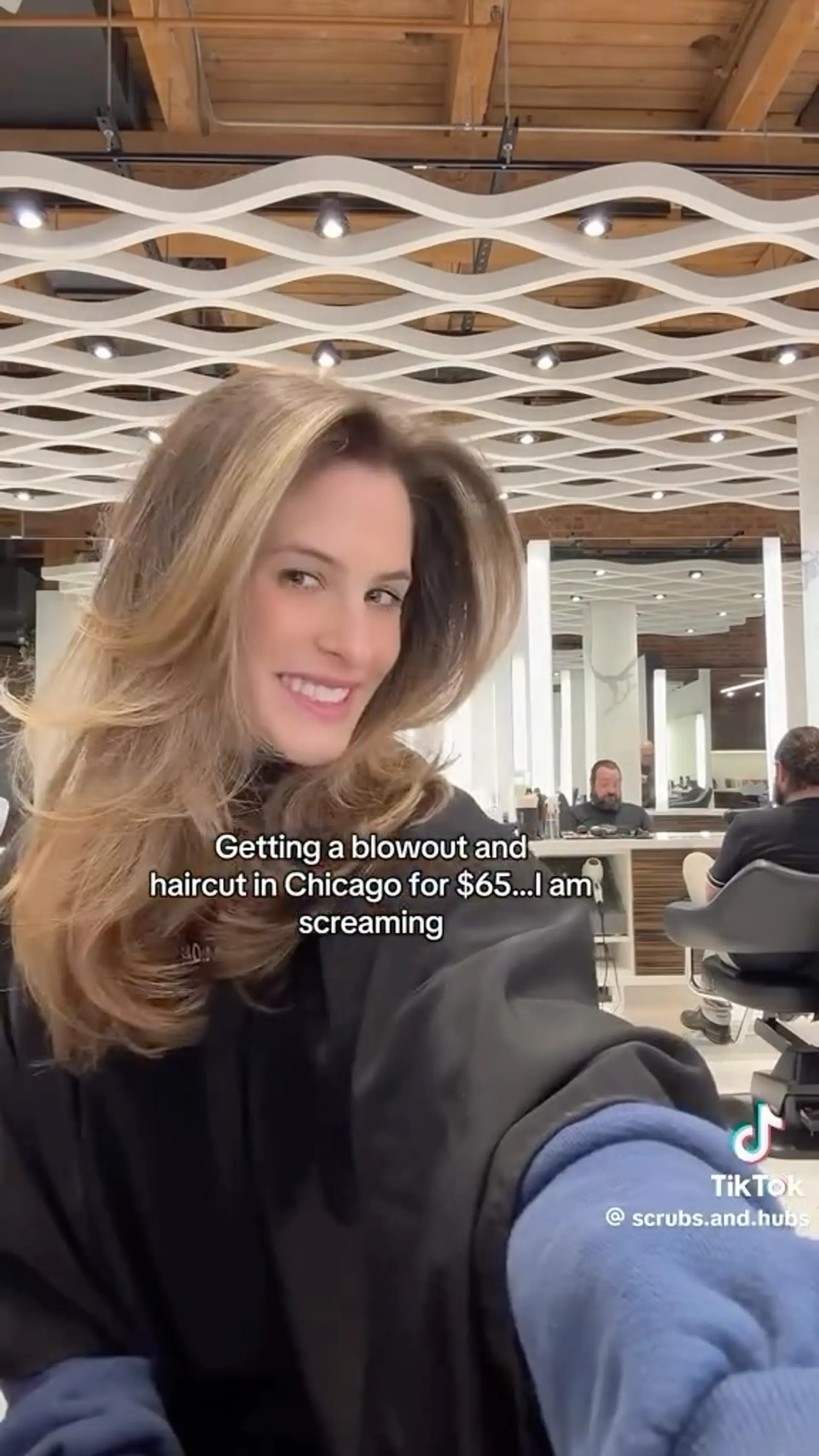 A voluminous layered blowout with sweeping face-framing layers and soft, curved ends. 1