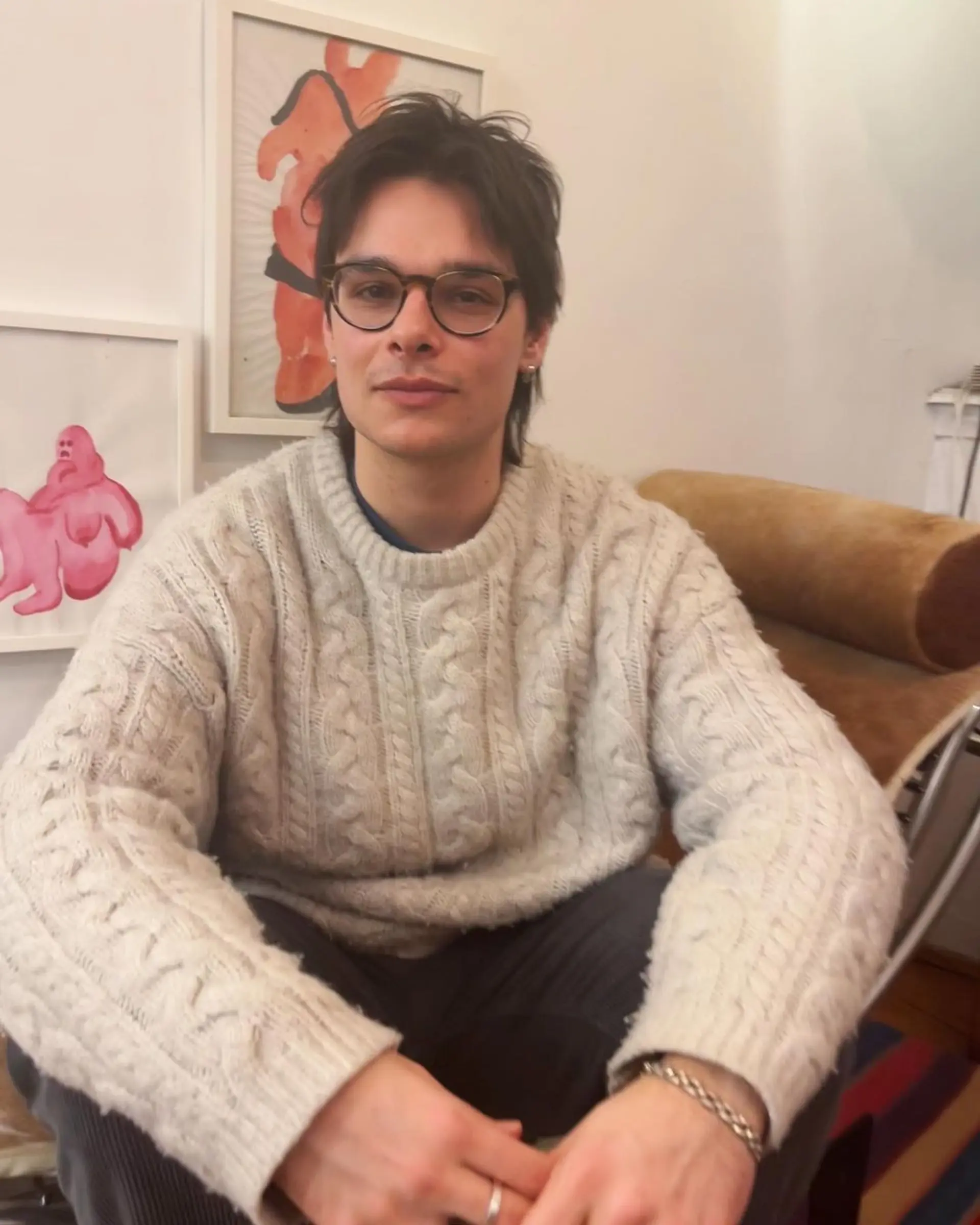 This look features a relaxed, medium length, layered cut for an adult male with straight, dark brown hair. The style includes a side-swept fringe and light texturing, creating a natural, casually sophisticated appearance. 2