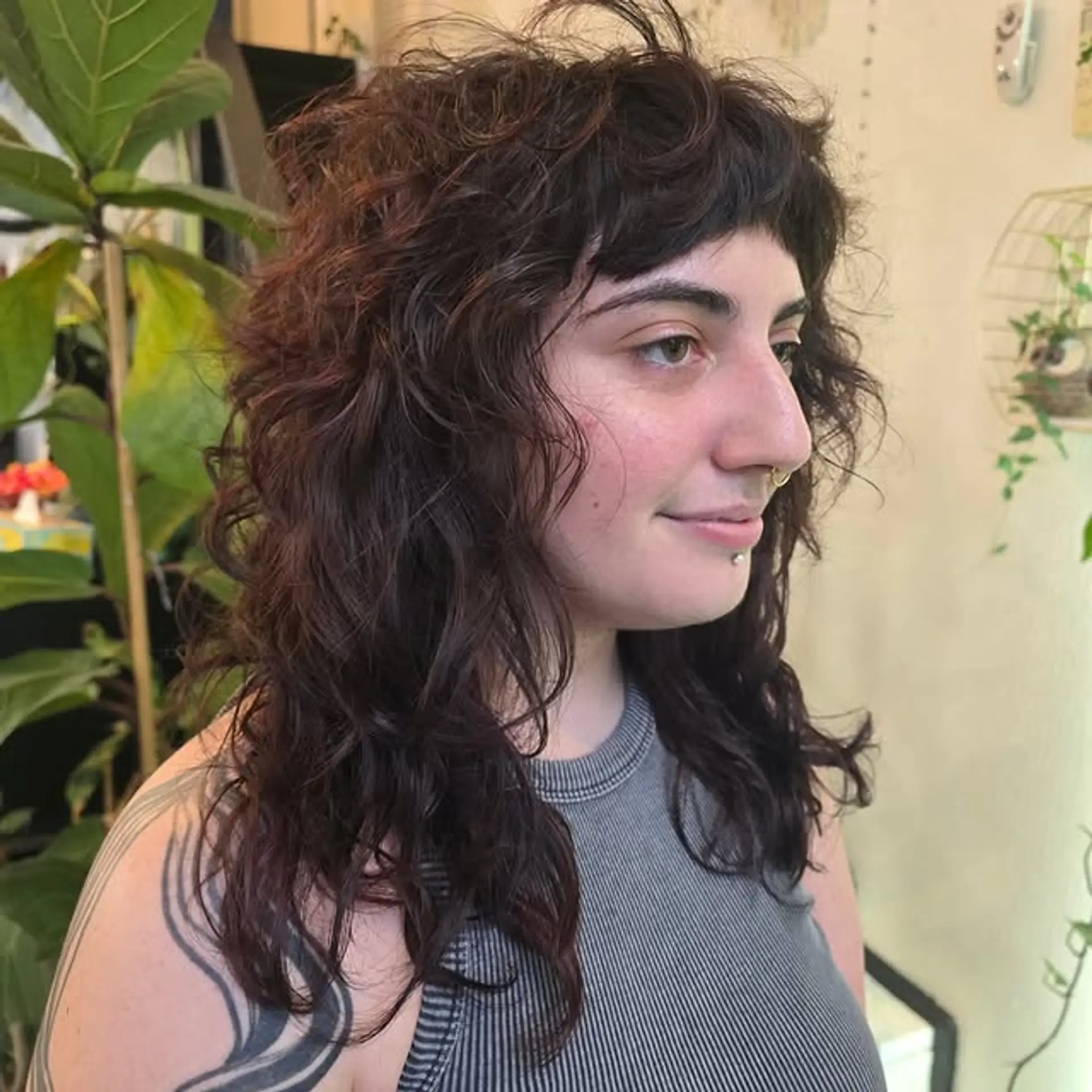 A modern shag haircut with choppy layers and baby bangs. 1