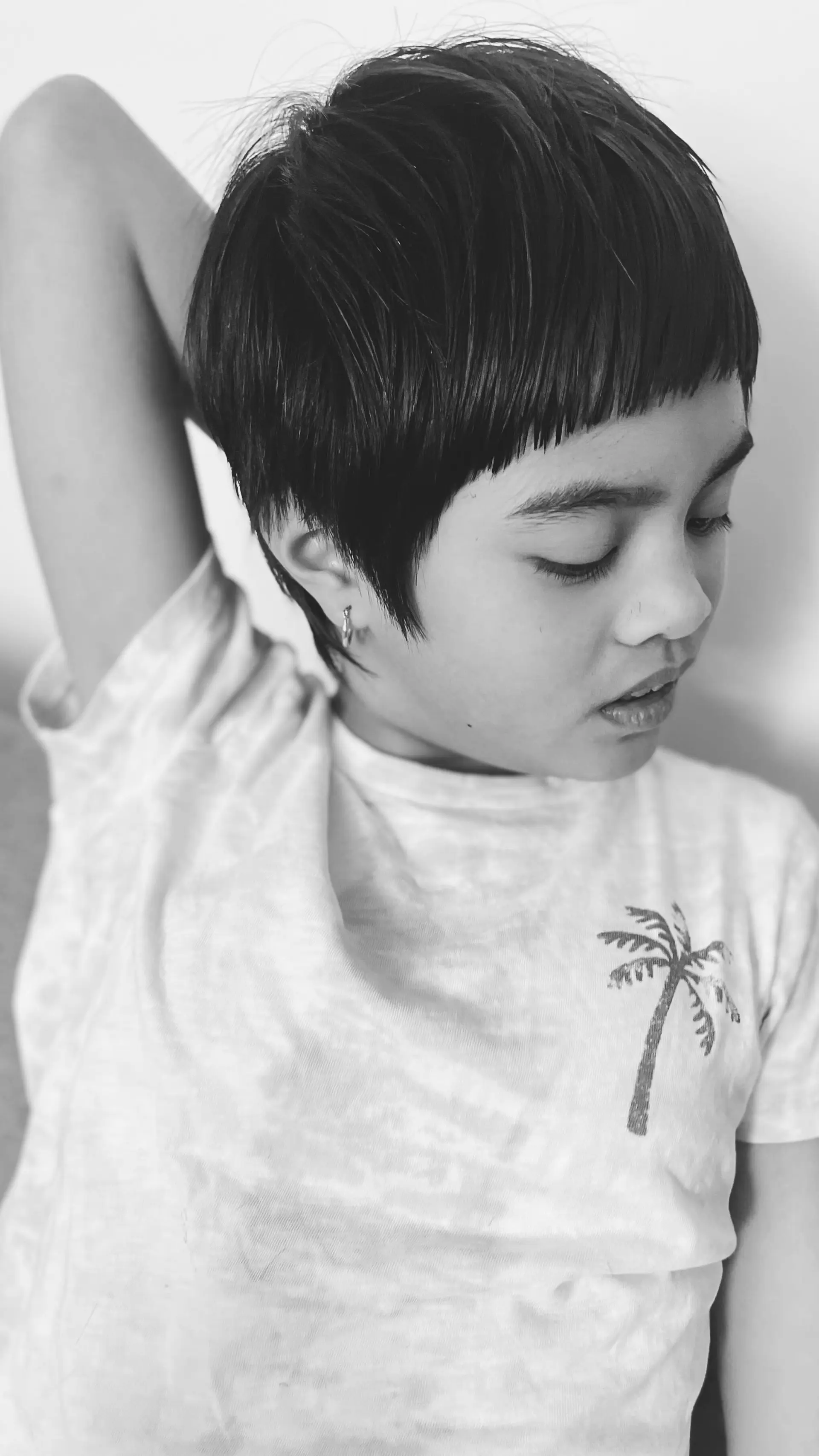 Short pixie crop featuring straight-across blunt micro bangs. 1